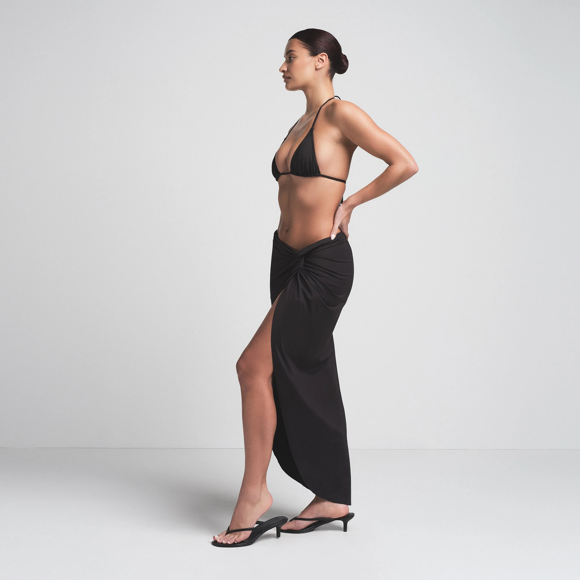SIGNATURE SWIM SARONG SKIRT | ONYX ON A MODEL SIDE VIEW | FOCUS: 0.0, 1.0, 0.9