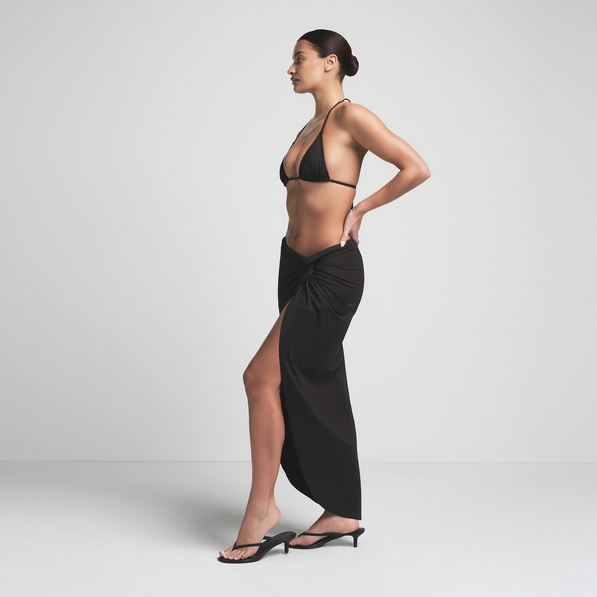 SIGNATURE SWIM SARONG SKIRT | ONYX ON A MODEL SIDE VIEW | FOCUS: 0.0, 1.0, 0.9