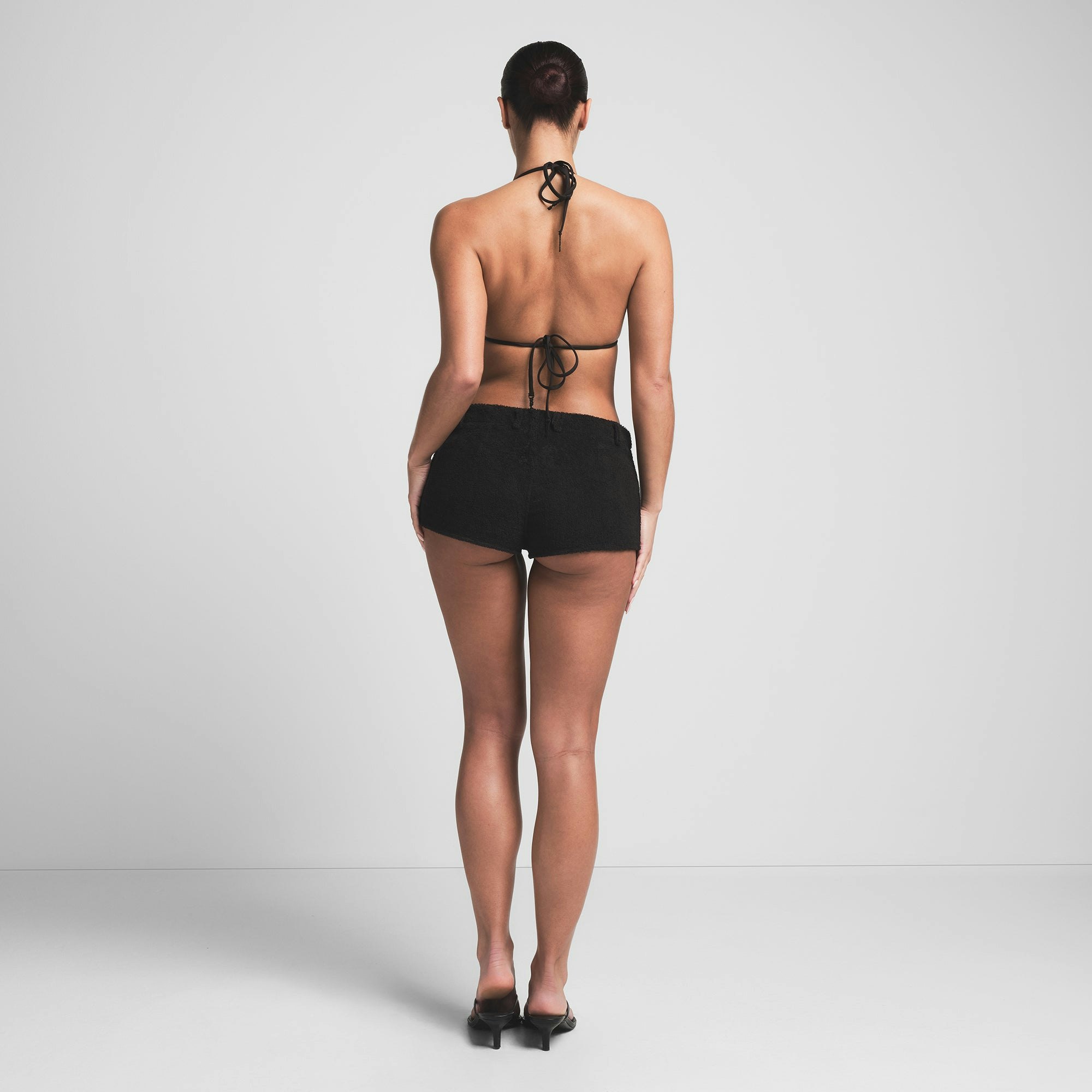 TERRY COVER UPS SHORT SHORT | ONYX ON A MODEL BACK VIEW | FOCUS: 0.0, 1.0, 0.9