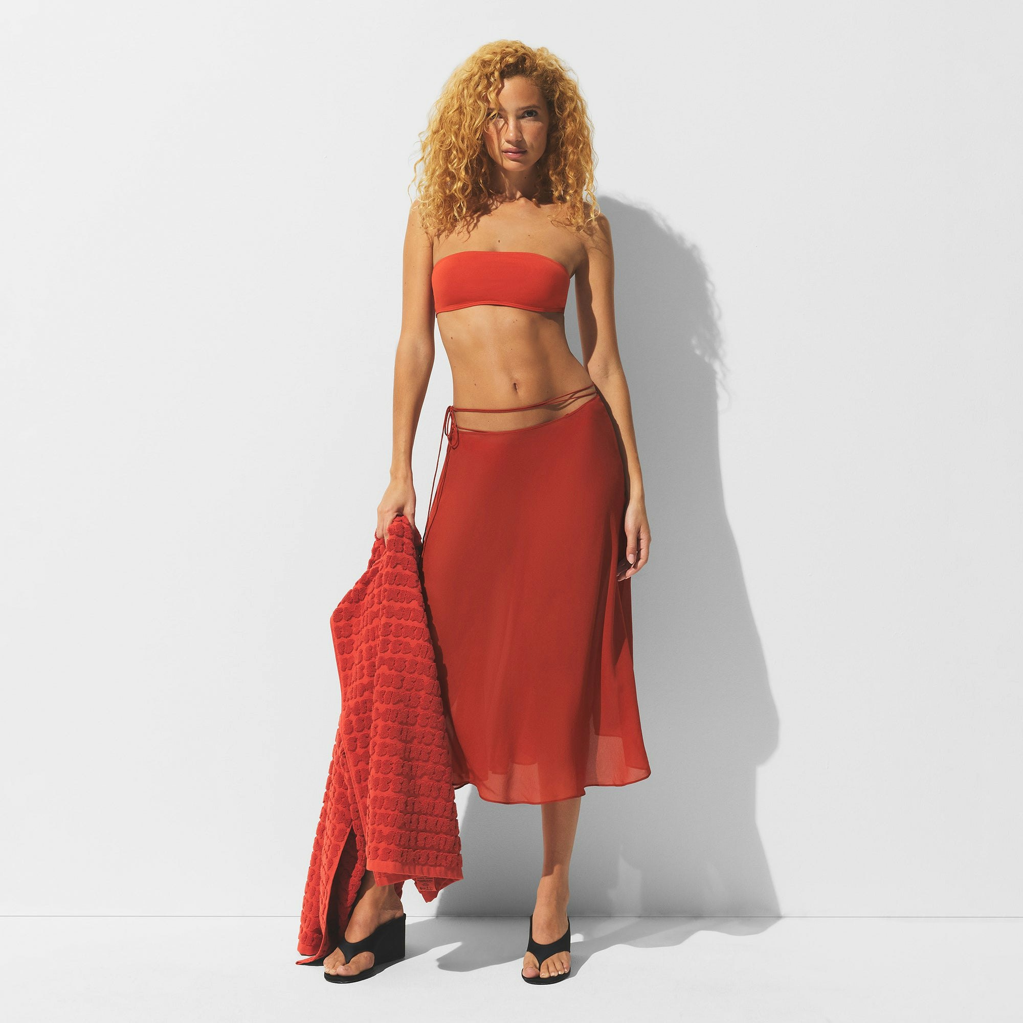 MINIMAL SWIM COVER UP MIDI SKIRT | AUBURN ON A MODEL FRONT VIEW | FOCUS: 0.0, 1.0, 0.9