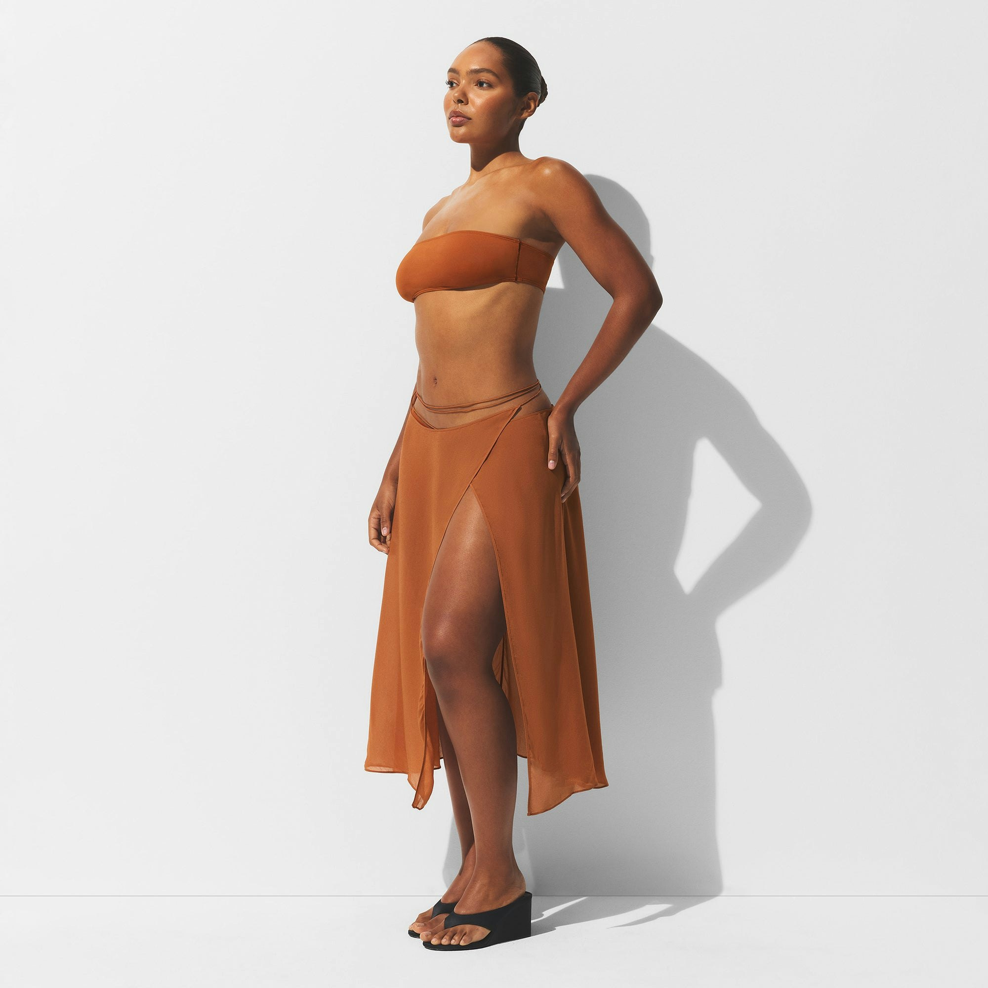MINIMAL SWIM COVER UP MIDI SKIRT | CHESTNUT ON A MODEL SIDE VIEW | FOCUS: 0.0, 1.0, 0.9