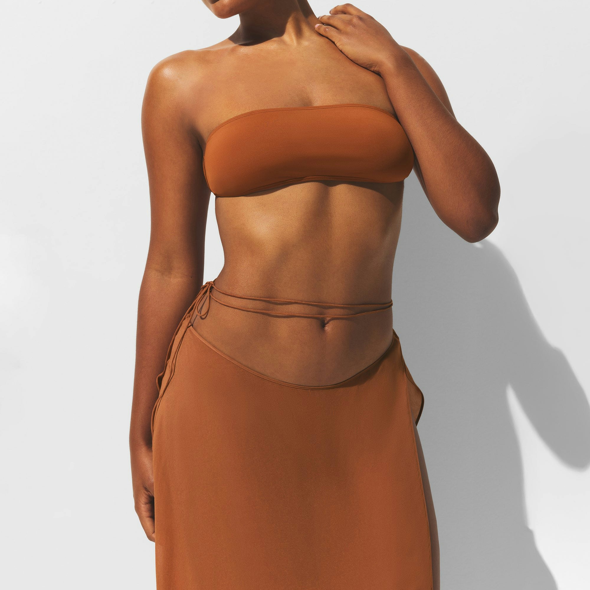 MINIMAL SWIM COVER UP MIDI SKIRT | CHESTNUT ON A MODEL FRONT VIEW | FOCUS: 0.0, 1.0, 0.9