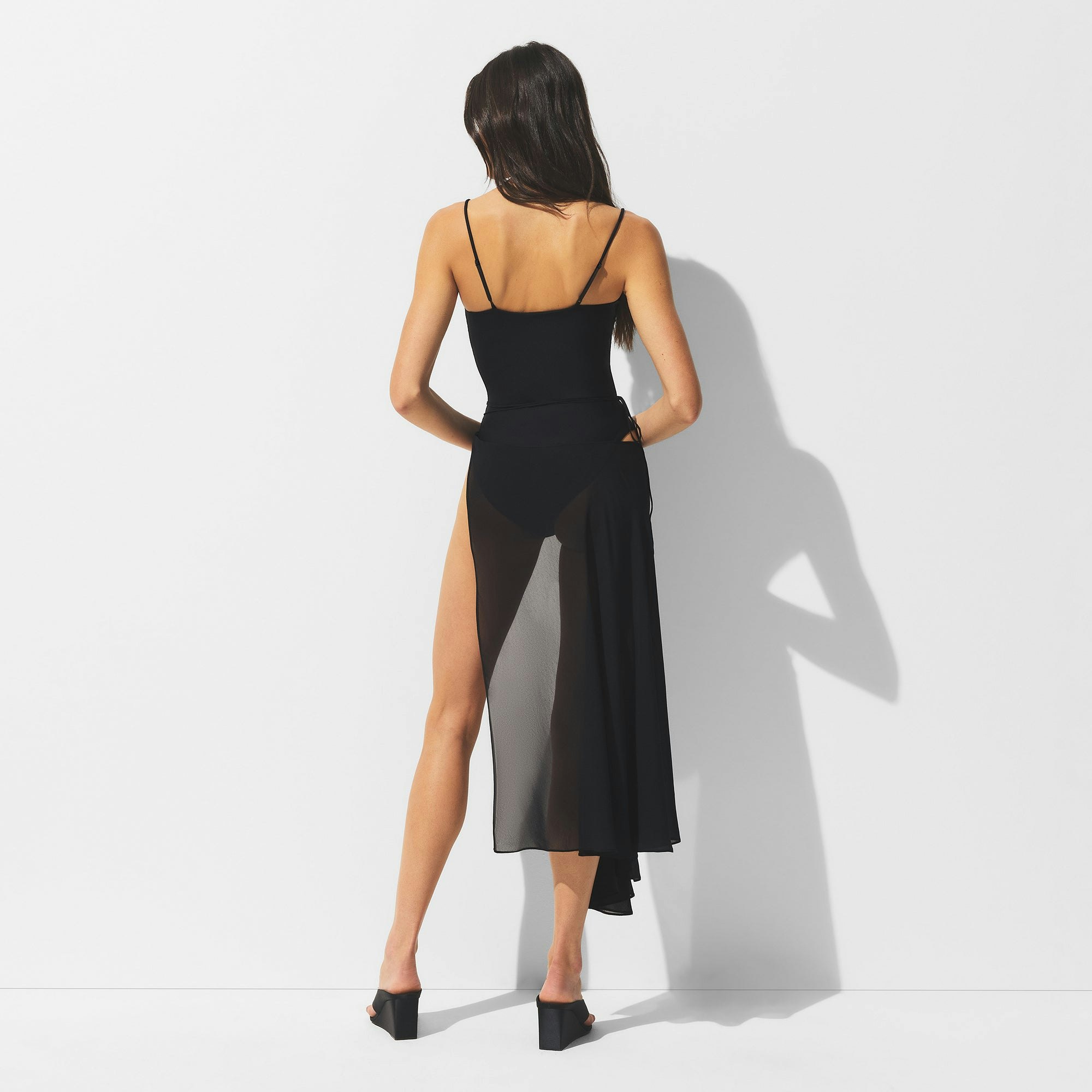 MINIMAL SWIM COVER UP MIDI SKIRT | OBSIDIAN ON A MODEL BACK VIEW | FOCUS: 0.0, 1.0, 0.9