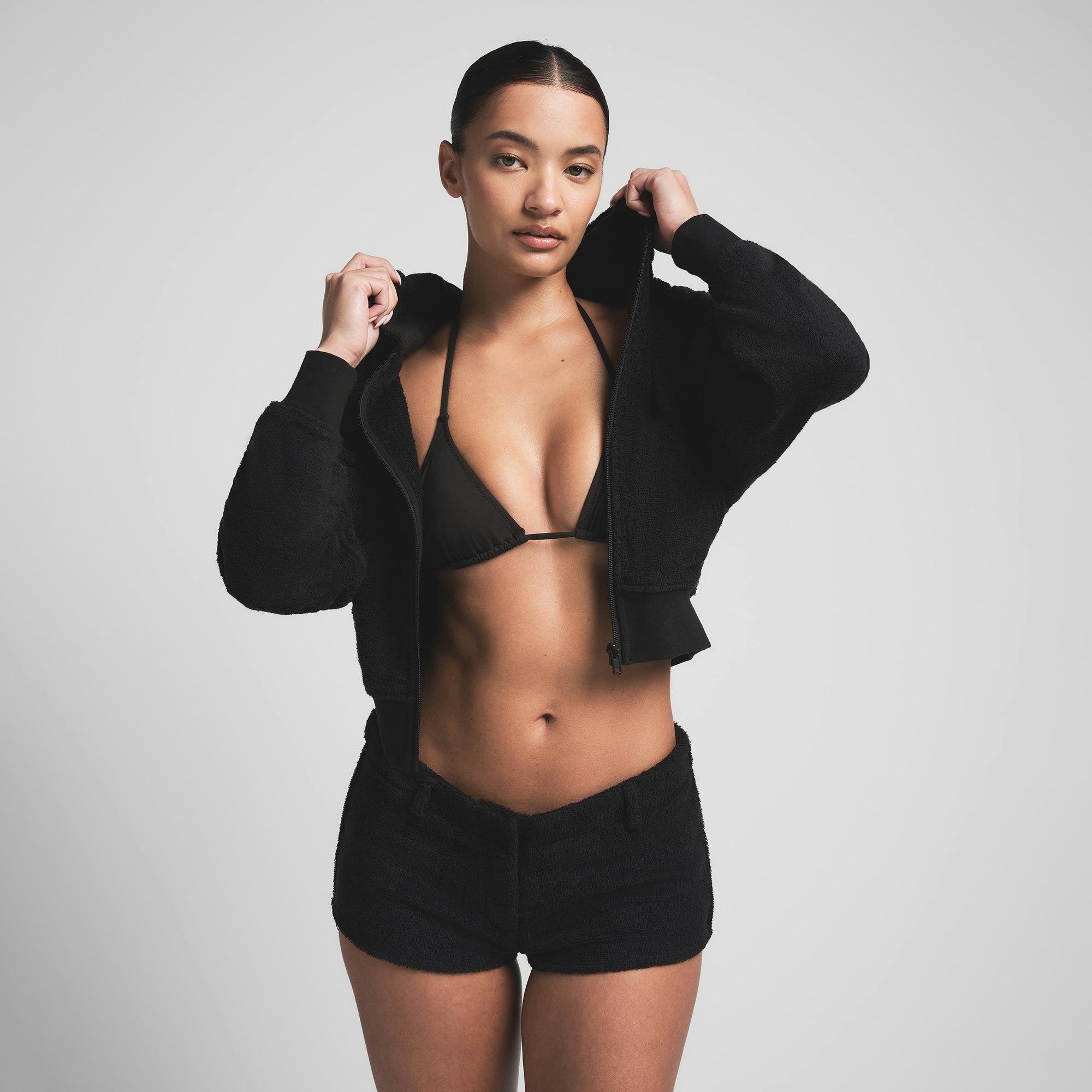 TERRY COVER UPS ZIP UP HOODIE | ONYX ON A MODEL FRONT VIEW | FOCUS: 0.0, 1.0, 0.9