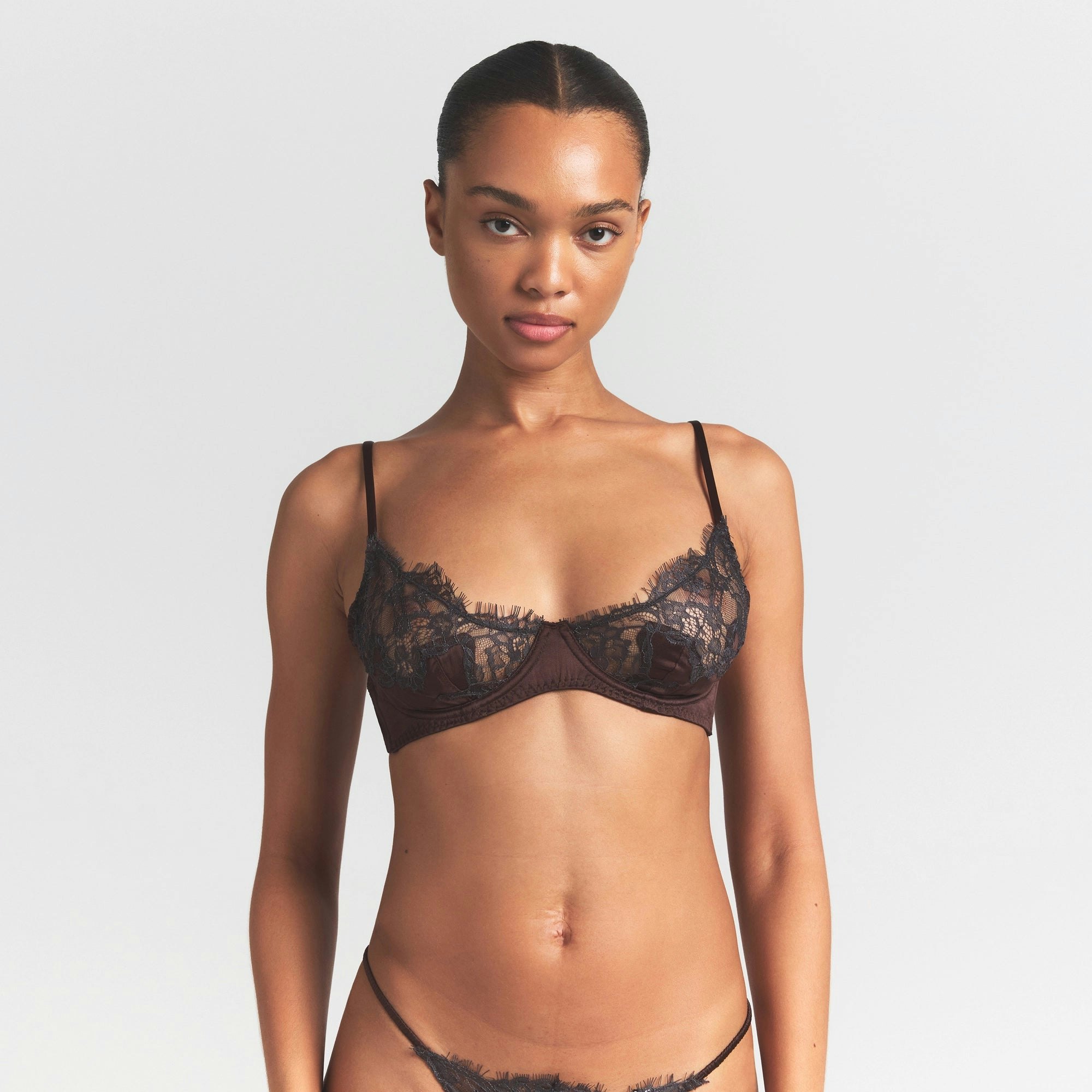 SILK LACE UNLINED DEMI BRA | ESPRESSO CONTRAST ON A MODEL SIDE VIEW @ | FOCUS: 0.0, 1.0, 0.9