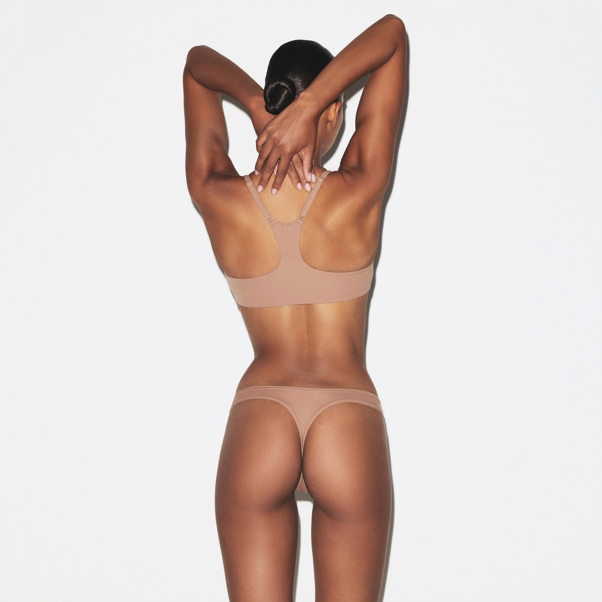 FITS EVERYBODY RACERBACK DEMI BRA | SIENNA ON A MODEL SIDE VIEW @ | FOCUS: 0.0, 1.0, 0.9