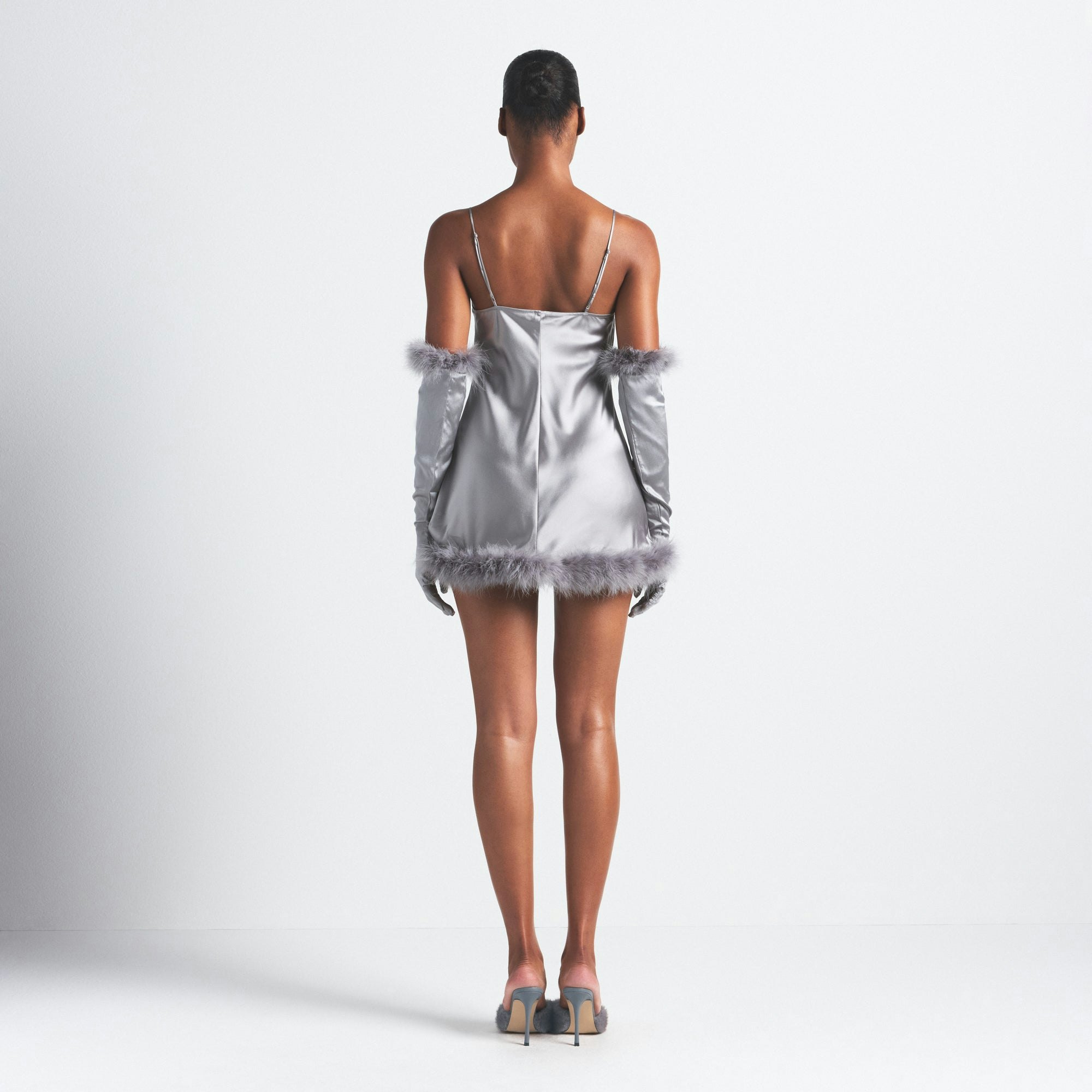 SILK FEATHER TRIM MINI DRESS | MIRROR ON A MODEL SIDE VIEW @ | FOCUS: 0.0, 1.0, 0.9