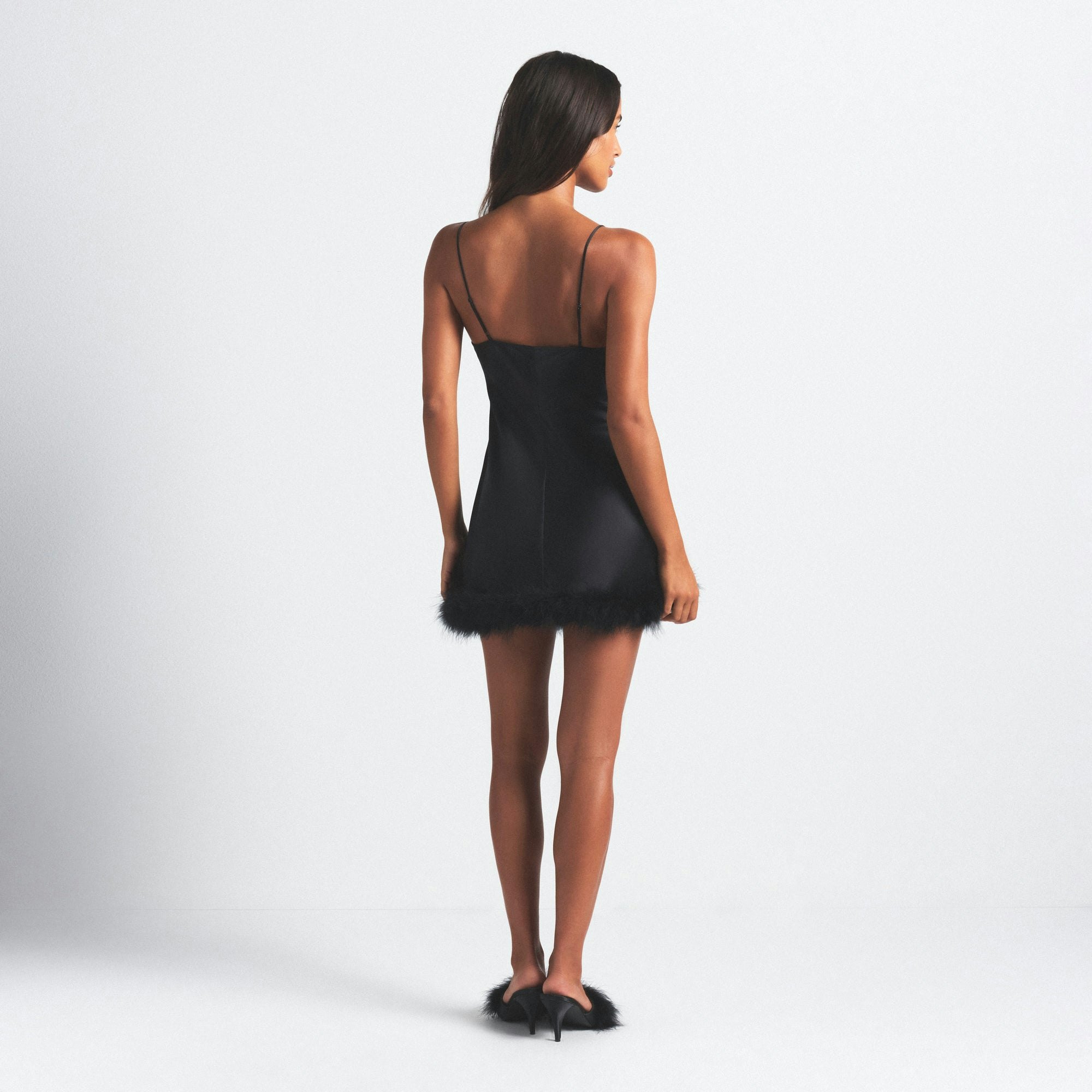 SILK FEATHER TRIM MINI DRESS | ONYX ON A MODEL SIDE VIEW @ | FOCUS: 0.0, 1.0, 0.9