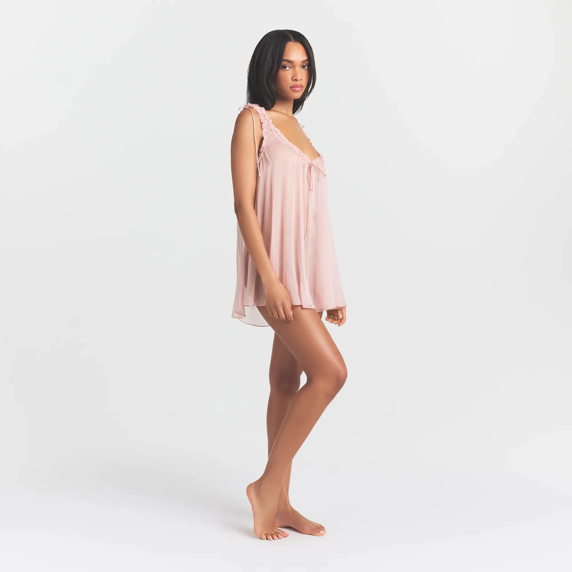 SKIMS ROMANCE MINI DRESS | MORGANITE ON A MODEL SIDE VIEW @ | FOCUS: 0.0, 1.0, 0.9