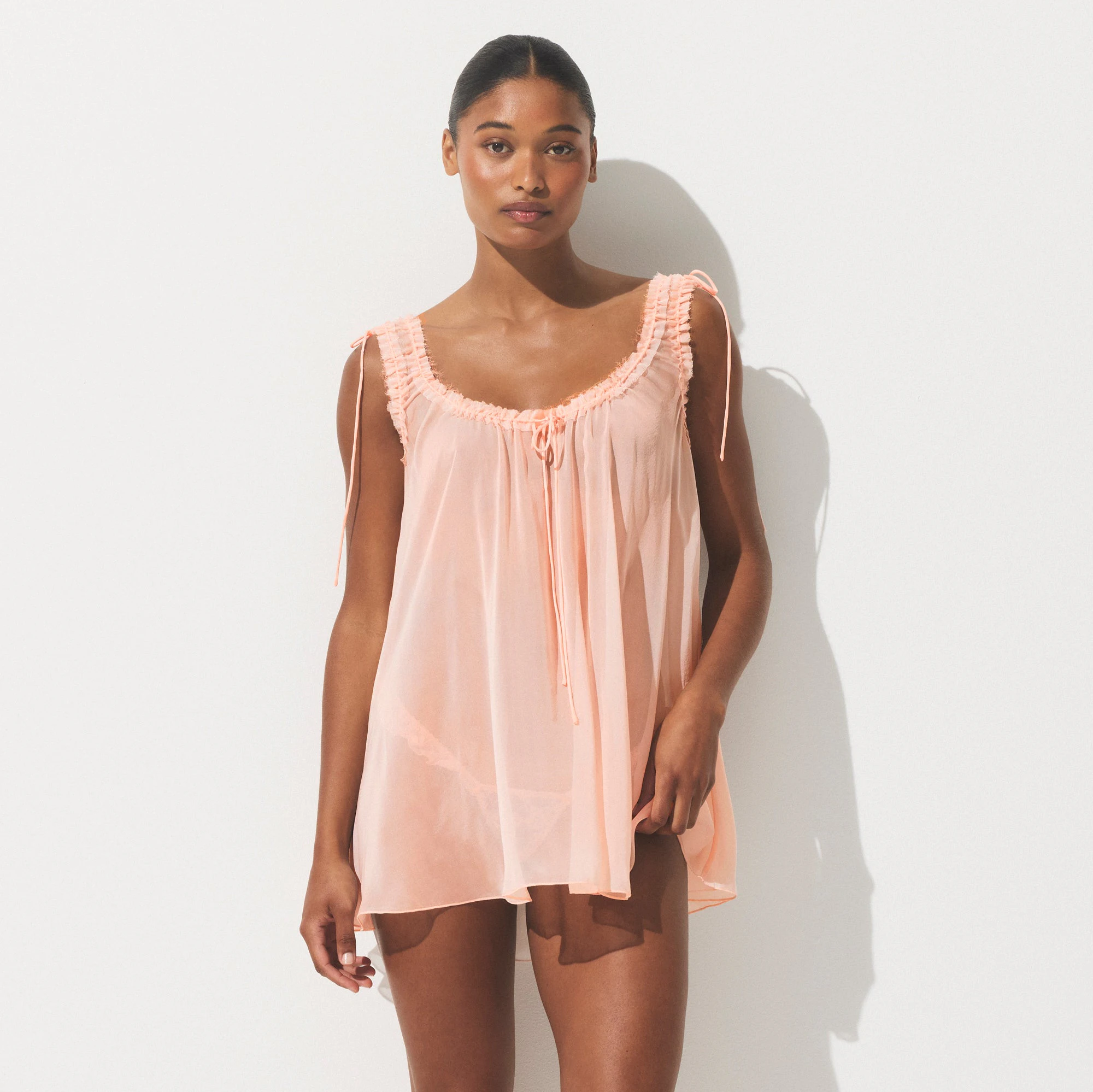 SKIMS ROMANCE MINI DRESS | PRIMROSE ON A MODEL SIDE VIEW | FOCUS: 0.0, 1.0, 0.9