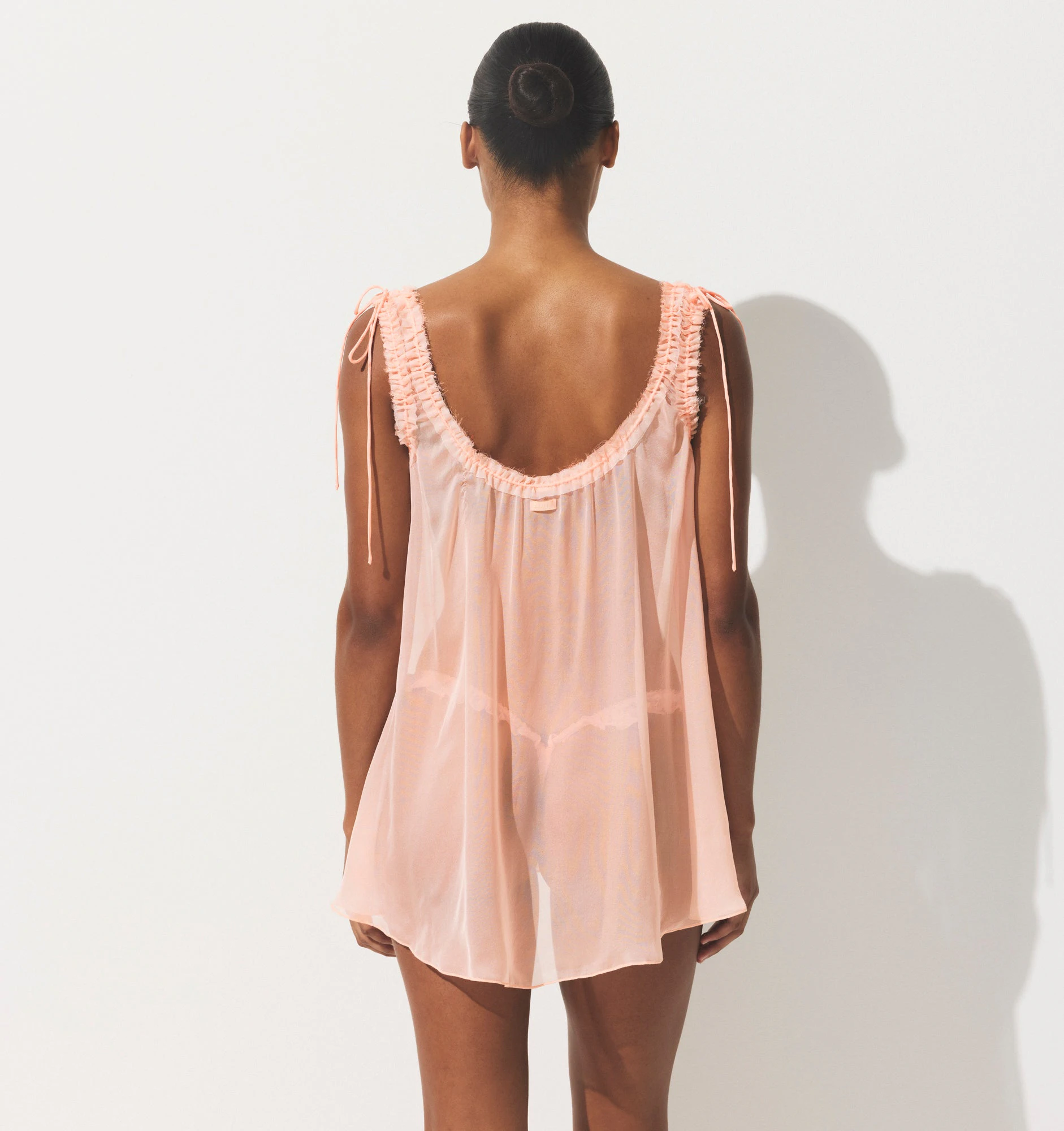 SKIMS ROMANCE MINI DRESS | PRIMROSE ON A MODEL SIDE VIEW | FOCUS: 0.0, 1.0, 0.9