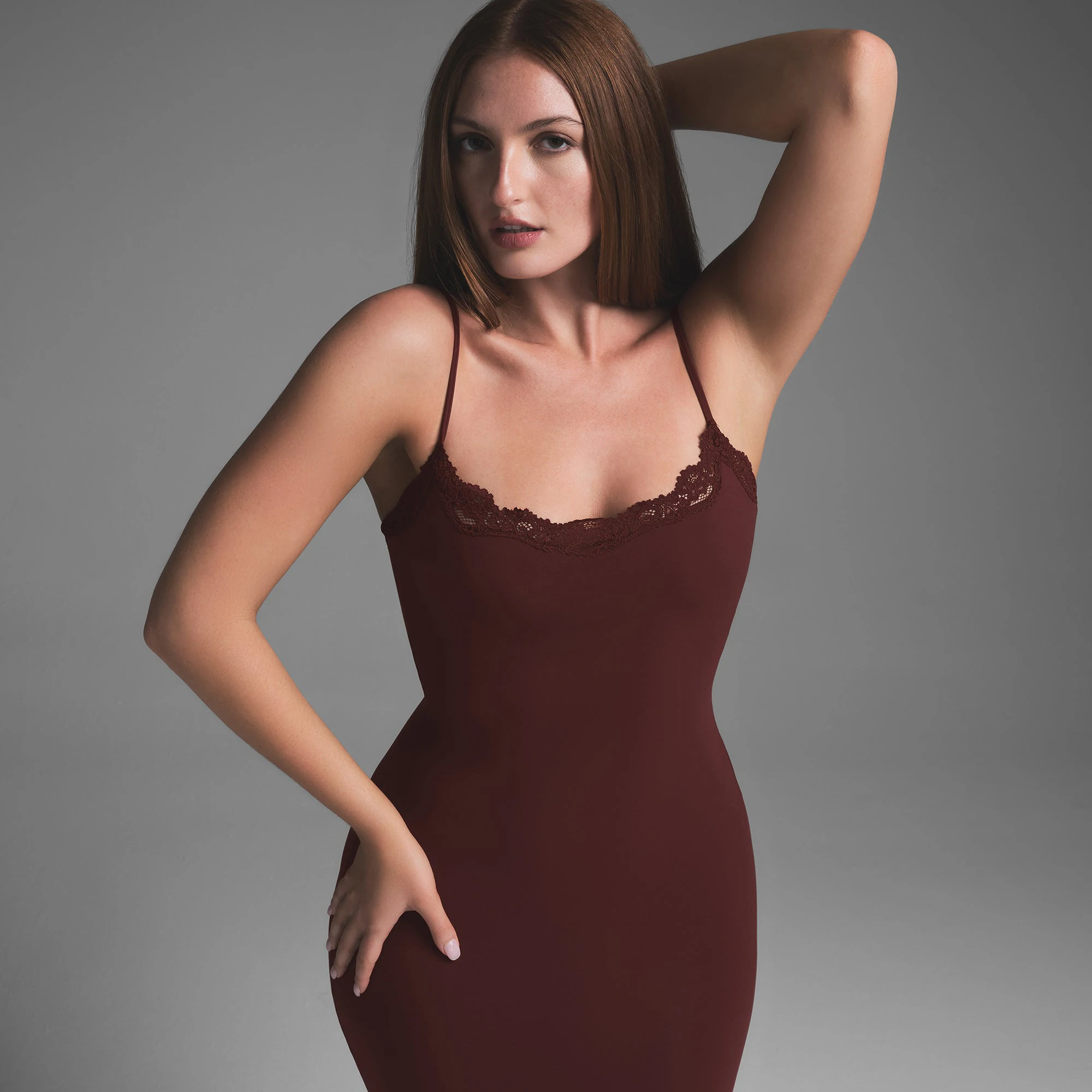 FITS EVERYBODY LACE LONG SLIP DRESS | OXBLOOD ON A MODEL SIDE VIEW
