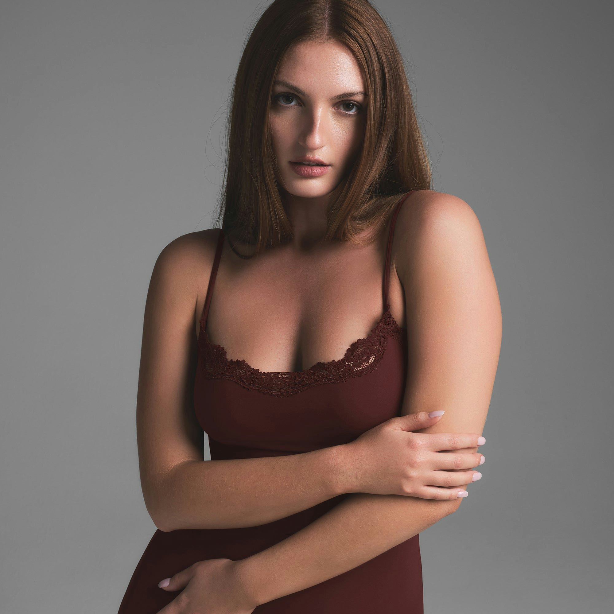 FITS EVERYBODY LACE LONG SLIP DRESS | OXBLOOD ON A MODEL SIDE VIEW