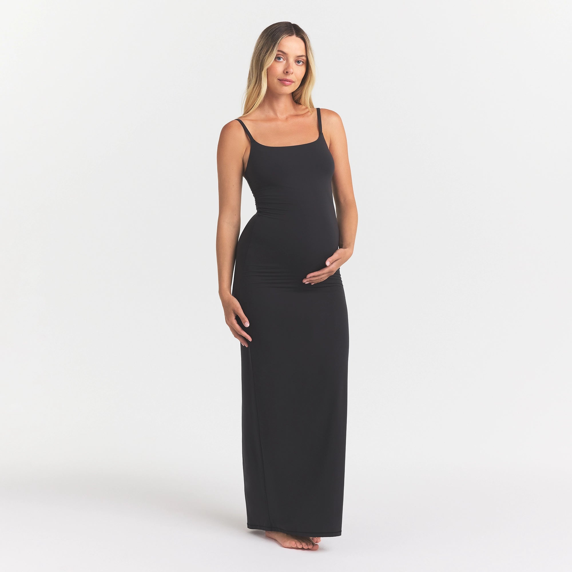 FITS EVERYBODY MATERNITY LONG SLIP DRESS | ONYX ON A MODEL FRONT VIEW
