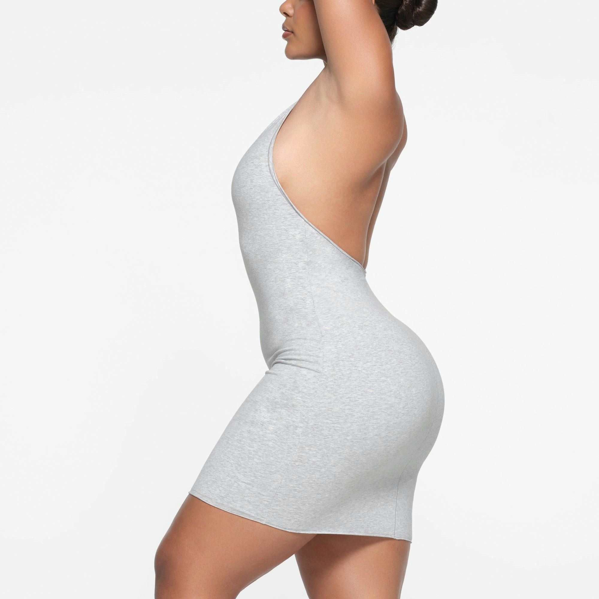COTTON TWIST HALTER MINI DRESS | LIGHT HEATHER GREY ON A MODEL SIDE VIEW