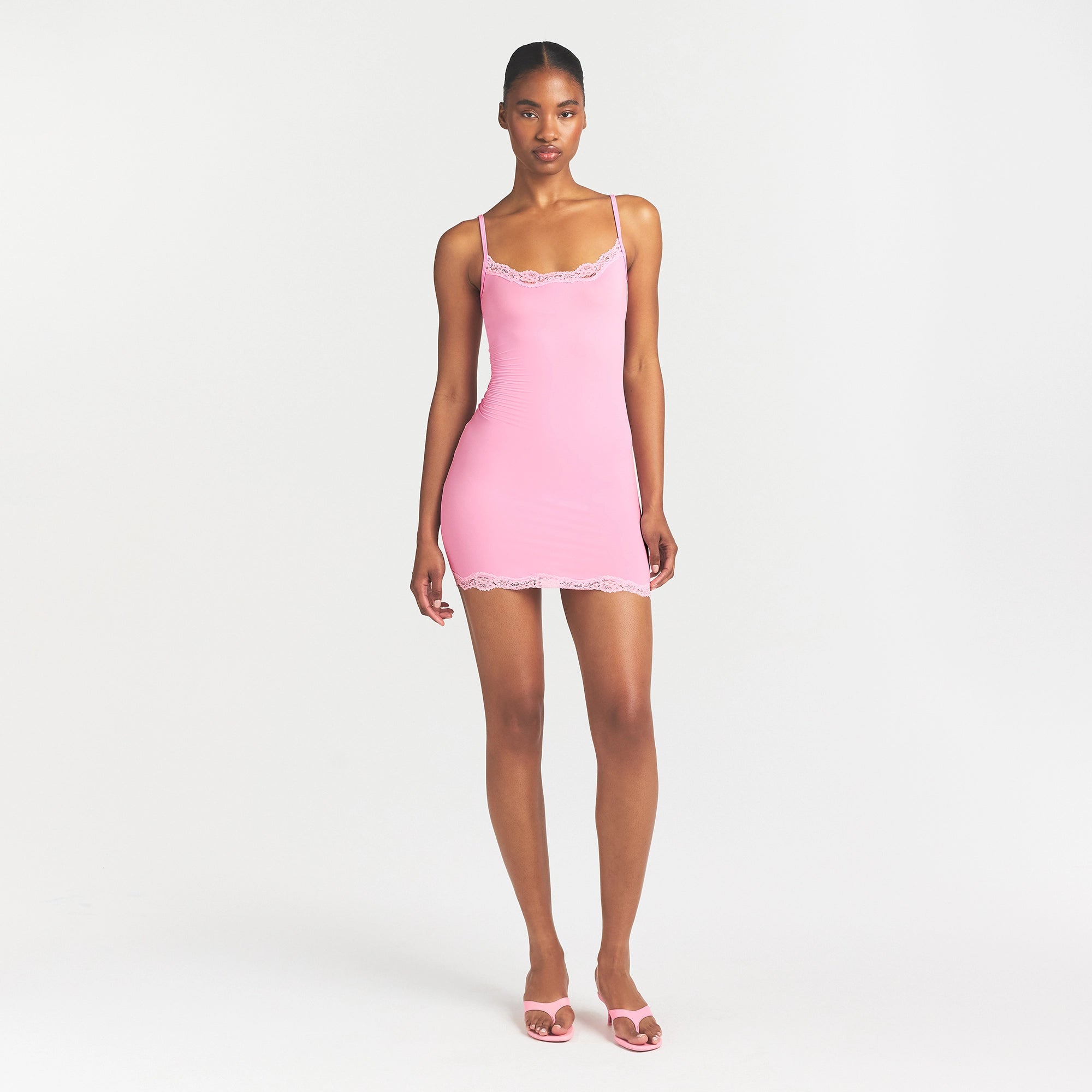 FITS EVERYBODY LACE SLIP DRESS | BUBBLE GUM TONAL ON A MODEL FRONT VIEW @ | FOCUS: 0.0, 1.0, 0.9
