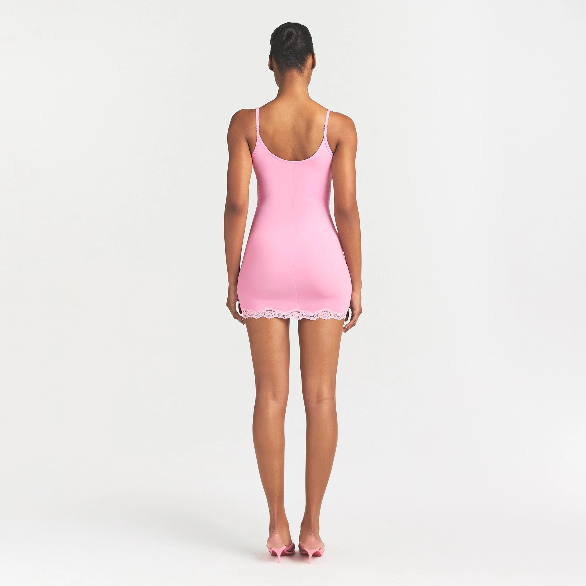 FITS EVERYBODY LACE SLIP DRESS | BUBBLE GUM TONAL ON A MODEL BACK VIEW @ | FOCUS: 0.0, 1.0, 0.9