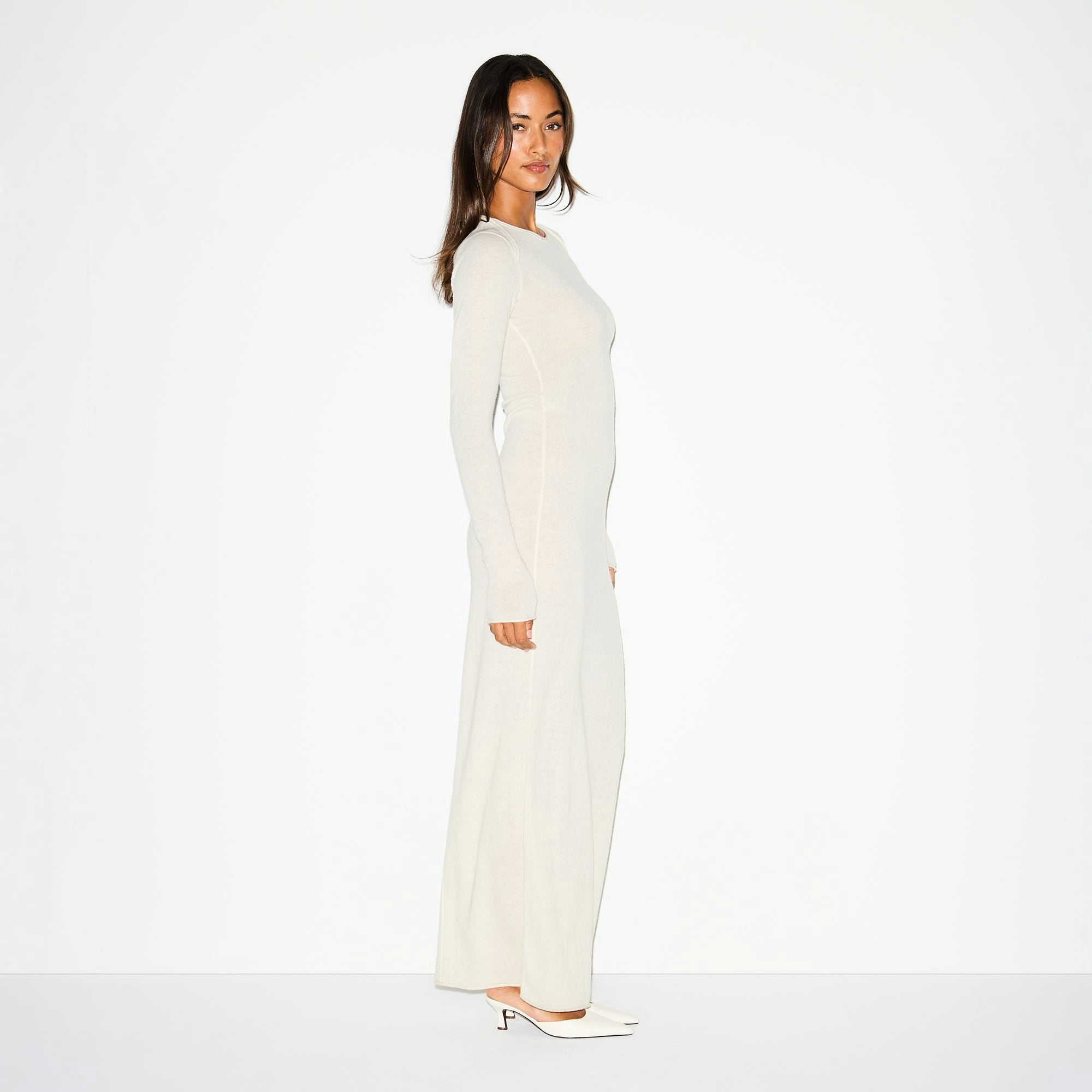 FEATHERWEIGHT CASHMERE LONG SLEEVE MAXI DRESS | EGRET ON A MODEL SIDE VIEW @ | FOCUS: 0.0, 1.0, 0.9