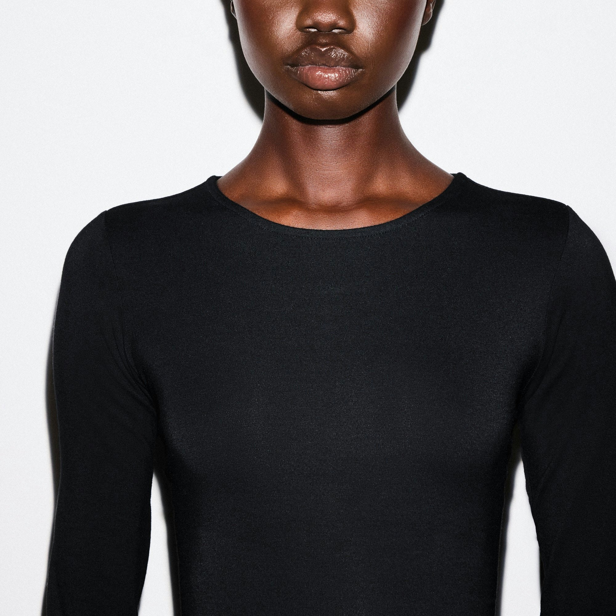SMOOTH LAYERS CREWNECK MINI DRESS | OBSIDIAN ON A MODEL SIDE VIEW @ | FOCUS: 0.0, 1.0, 0.9