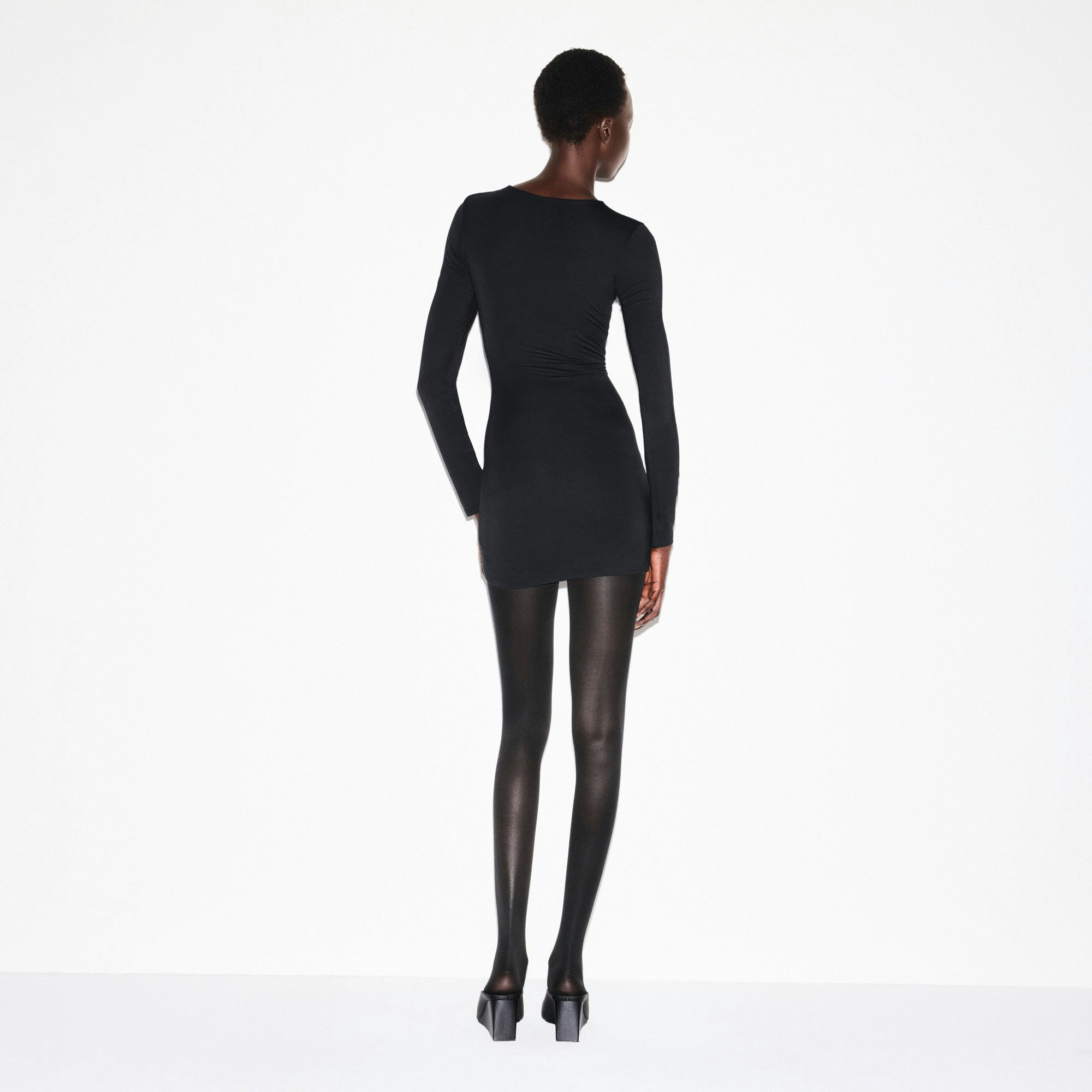 SMOOTH LAYERS CREWNECK MINI DRESS | OBSIDIAN ON A MODEL SIDE VIEW @ | FOCUS: 0.0, 1.0, 0.9