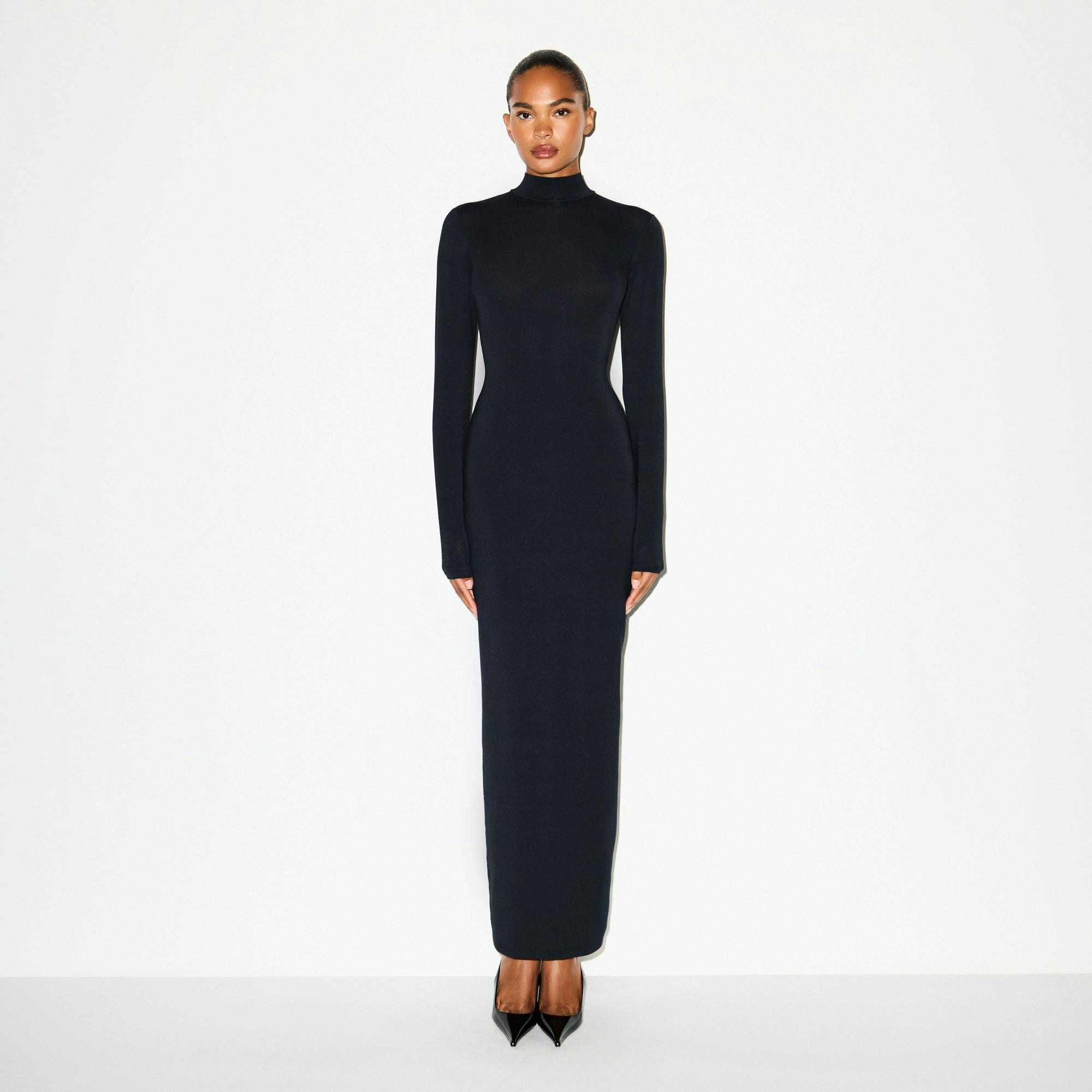 SMOOTH LAYERS TURTLENECK LONG DRESS | OBSIDIAN ON A MODEL FRONT VIEW @ | FOCUS: 0.0, 1.0, 0.9