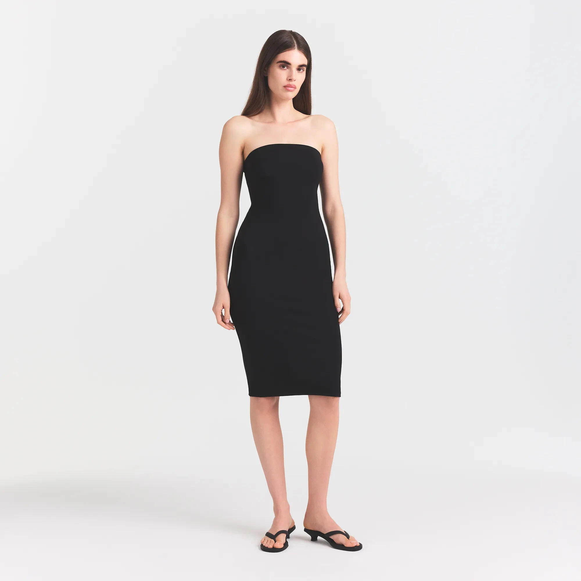 THE ESSENTIAL COLLECTION STRAPLESS MIDI DRESS | OBSIDIAN ON A MODEL FRONT VIEW @ | FOCUS: 0.0, 1.0, 0.9