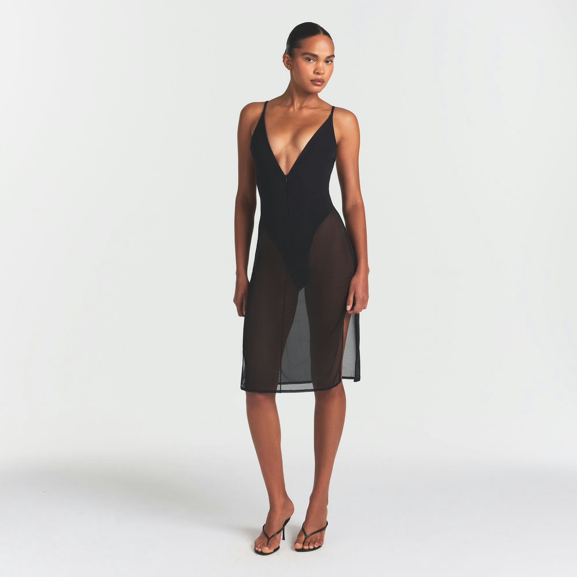 SKIMS BODY MESH PLUNGE MIDI DRESS | ONYX ON A MODEL FRONT VIEW @ | FOCUS: 0.0, 1.0, 0.9