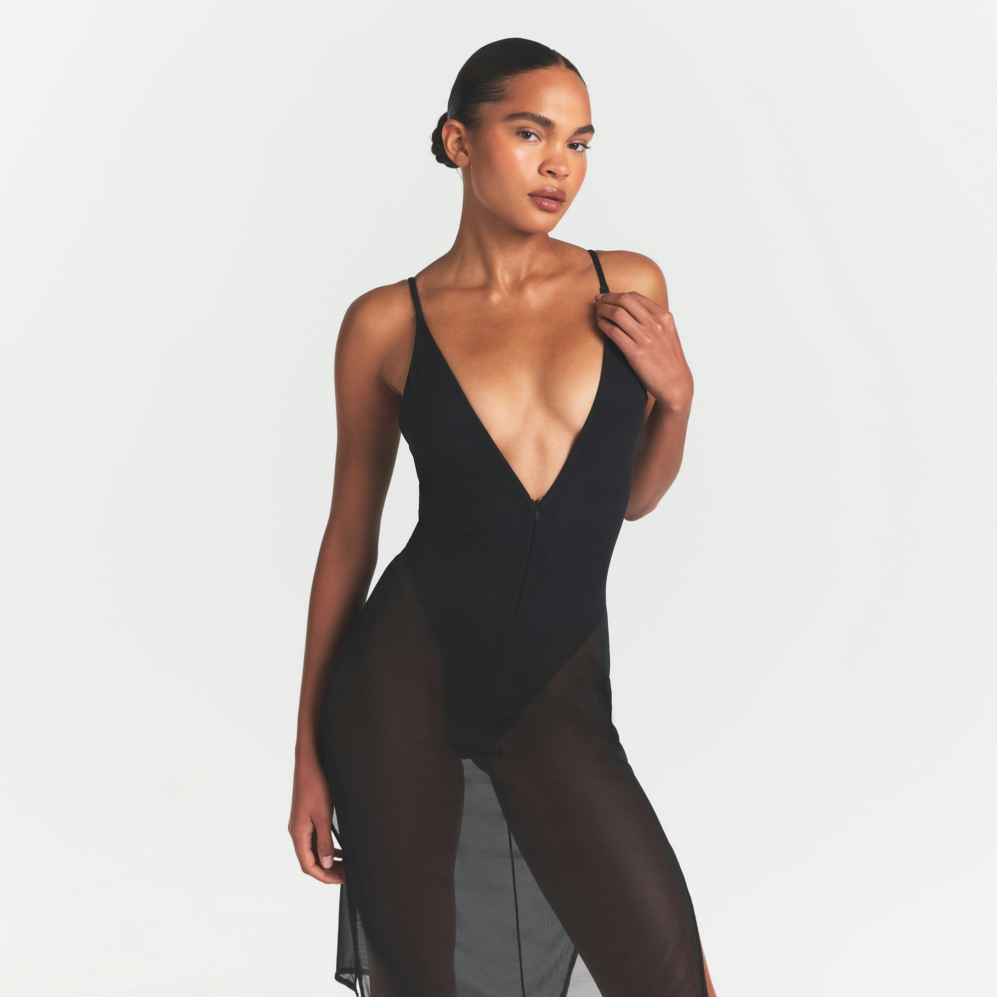 SKIMS BODY MESH PLUNGE MIDI DRESS | ONYX ON A MODEL SIDE VIEW @ | FOCUS: 0.0, 1.0, 0.9