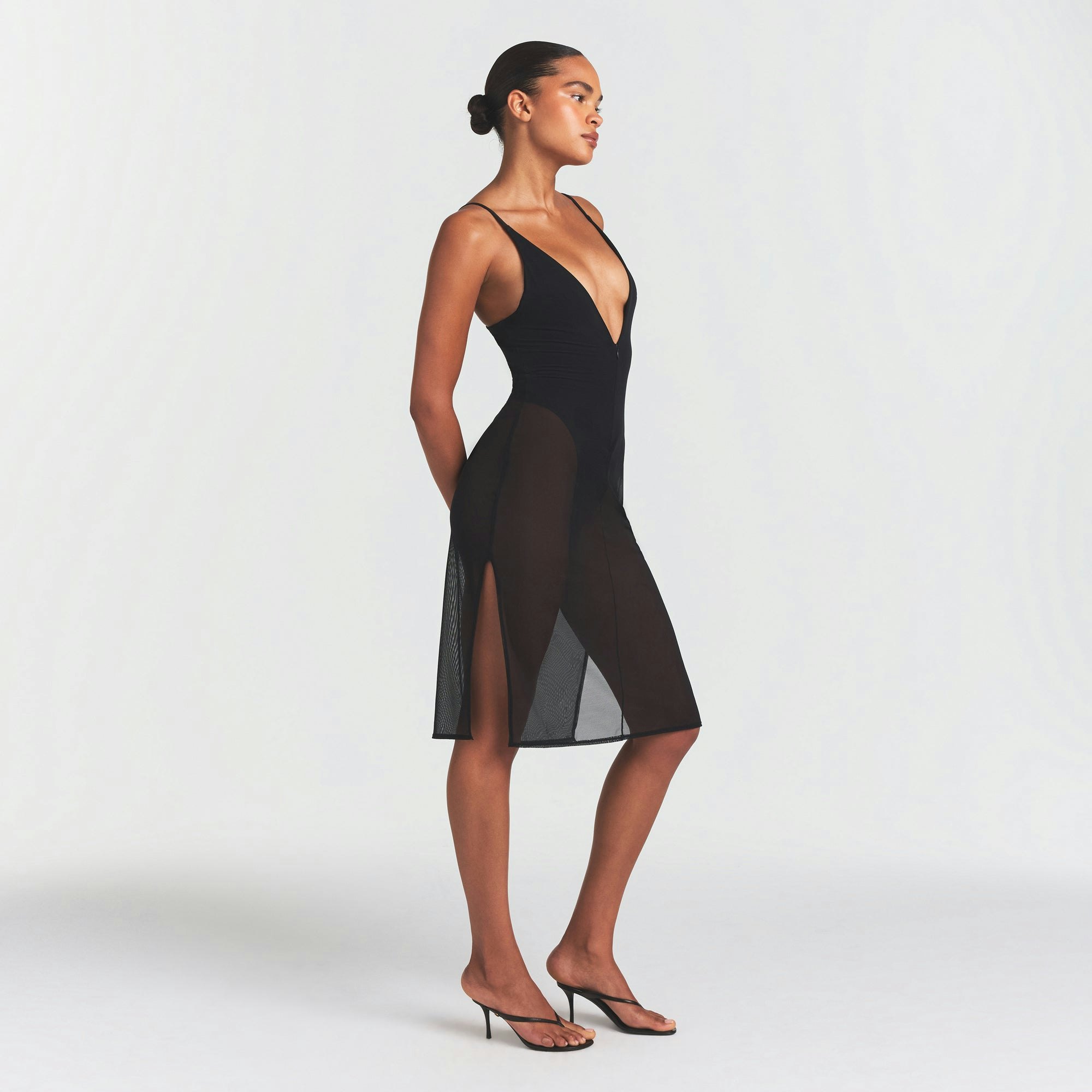 SKIMS BODY MESH PLUNGE MIDI DRESS | ONYX ON A MODEL FRONT VIEW @ | FOCUS: 0.0, 1.0, 0.9