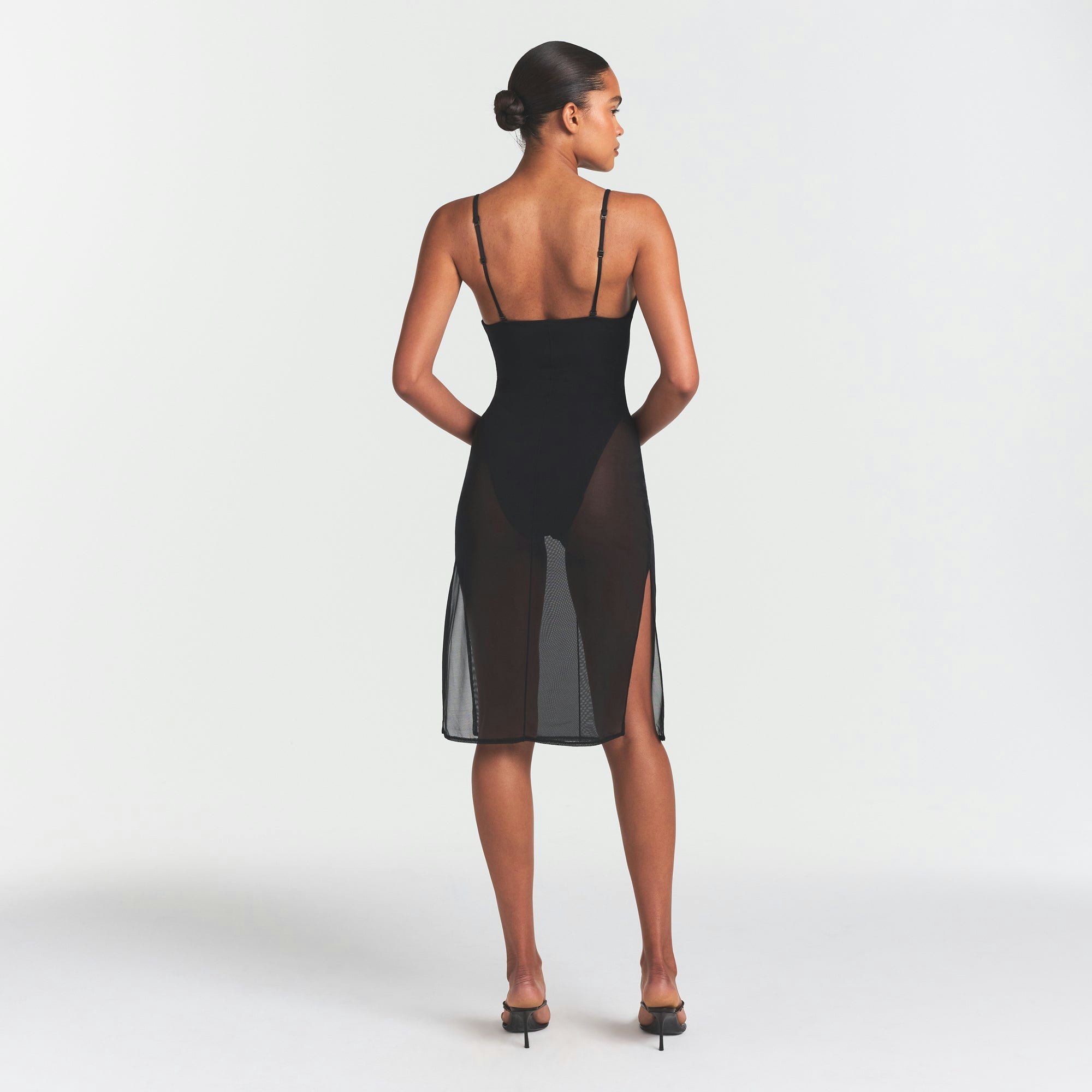 SKIMS BODY MESH PLUNGE MIDI DRESS | ONYX ON A MODEL FRONT VIEW @ | FOCUS: 0.0, 1.0, 0.9