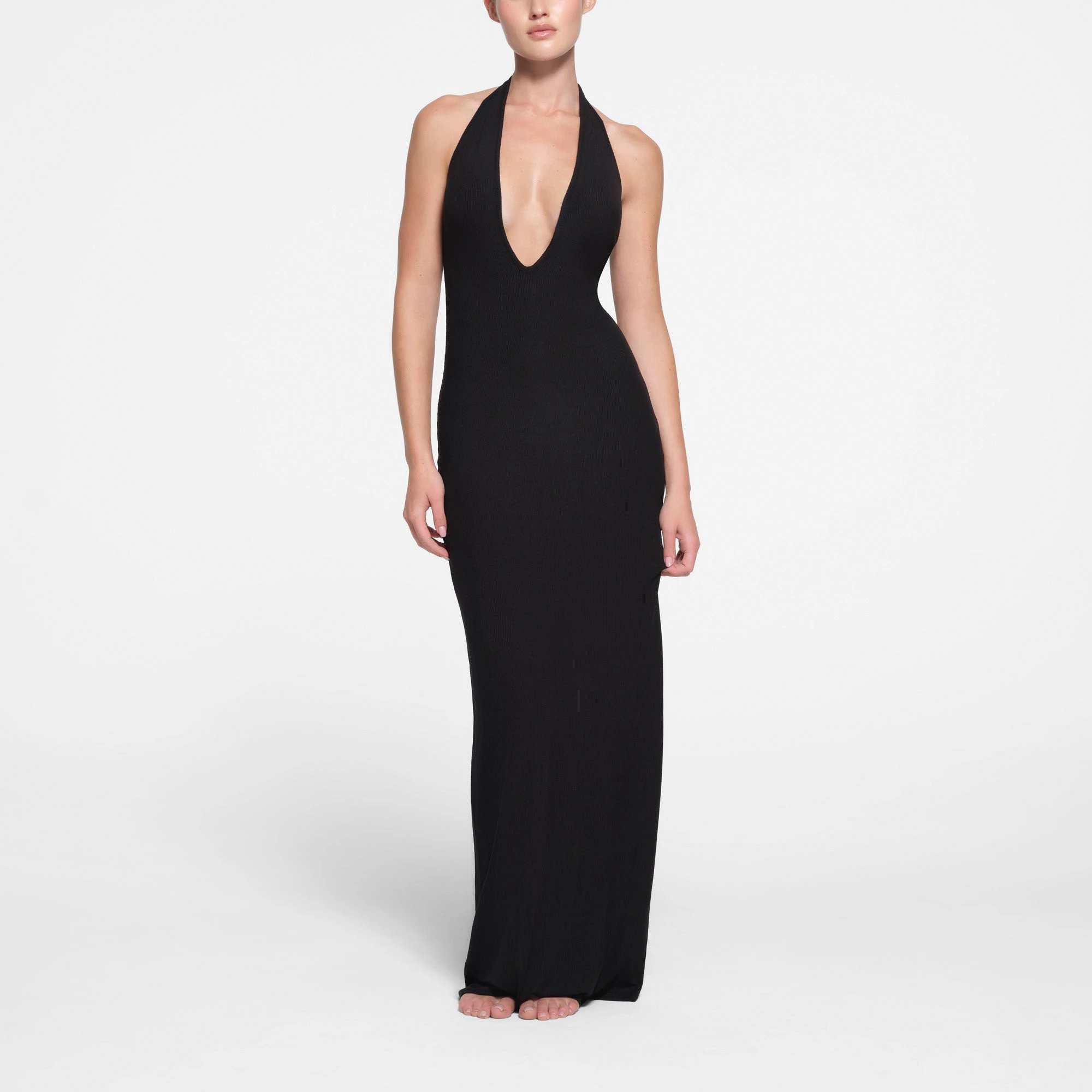 SOFT LOUNGE DEEP PLUNGE HALTER LONG DRESS | ONYX ON A MODEL FRONT VIEW