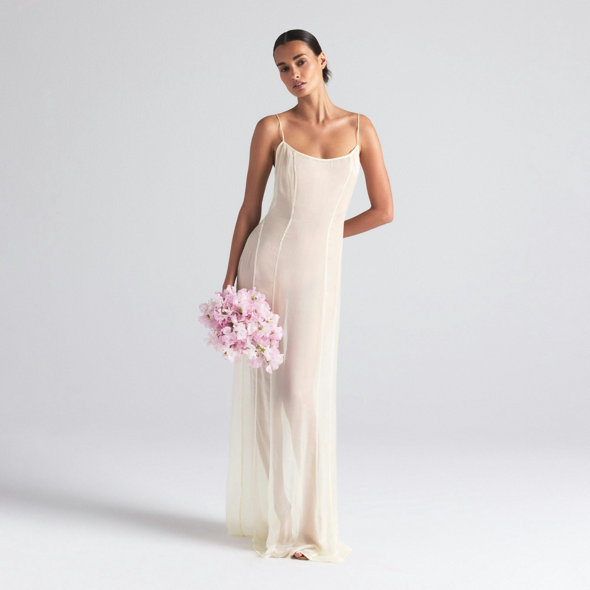 SKIMS ROMANCE LONG SLIP DRESS | IVORY ON A MODEL FRONT  ON A MODEL FRONT VIEW | FOCUS: 0.0, 1.0, 0.9