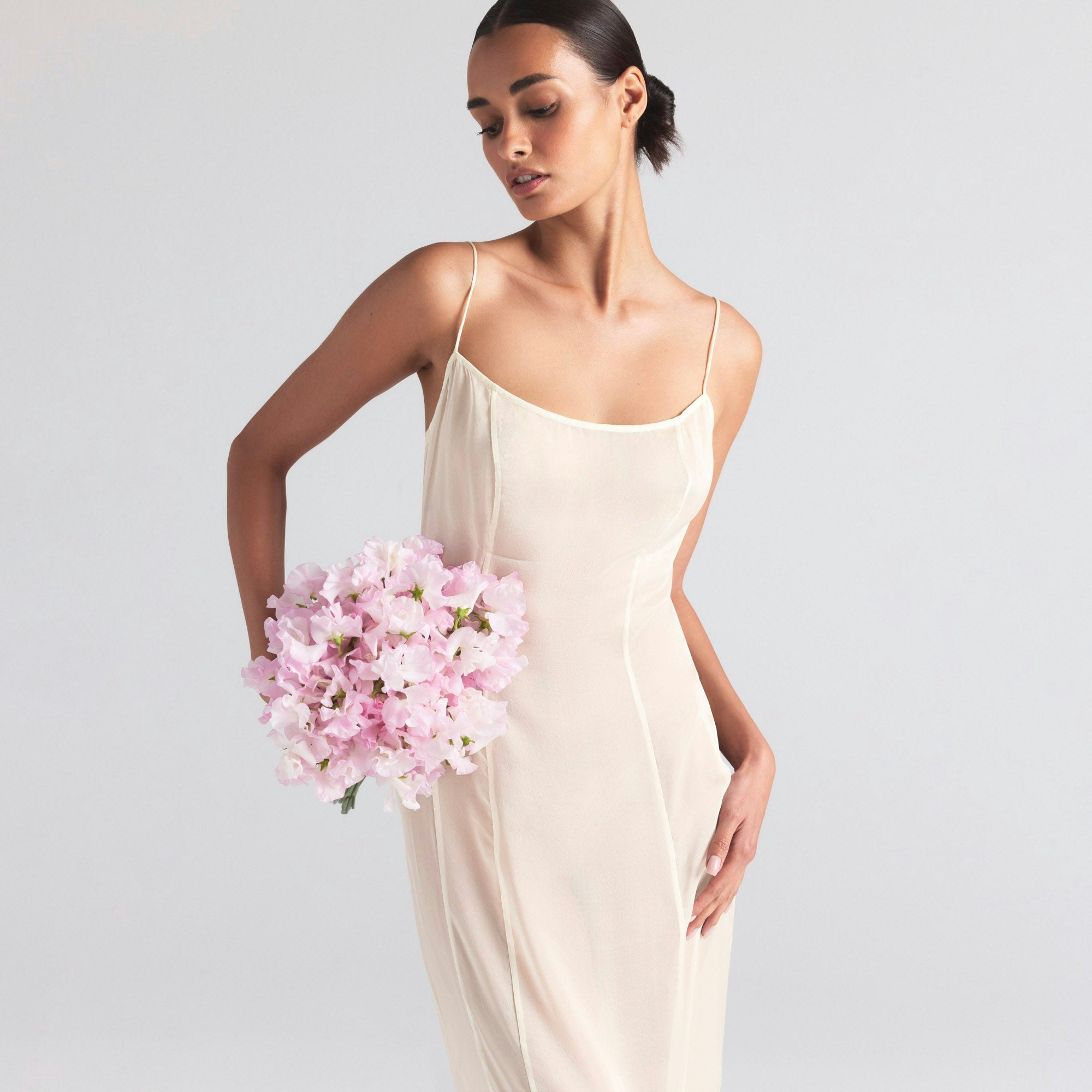 SKIMS ROMANCE LONG SLIP DRESS | IVORY ON A MODEL SIDE  ON A MODEL FRONT VIEW | FOCUS: 0.0, 1.0, 0.9