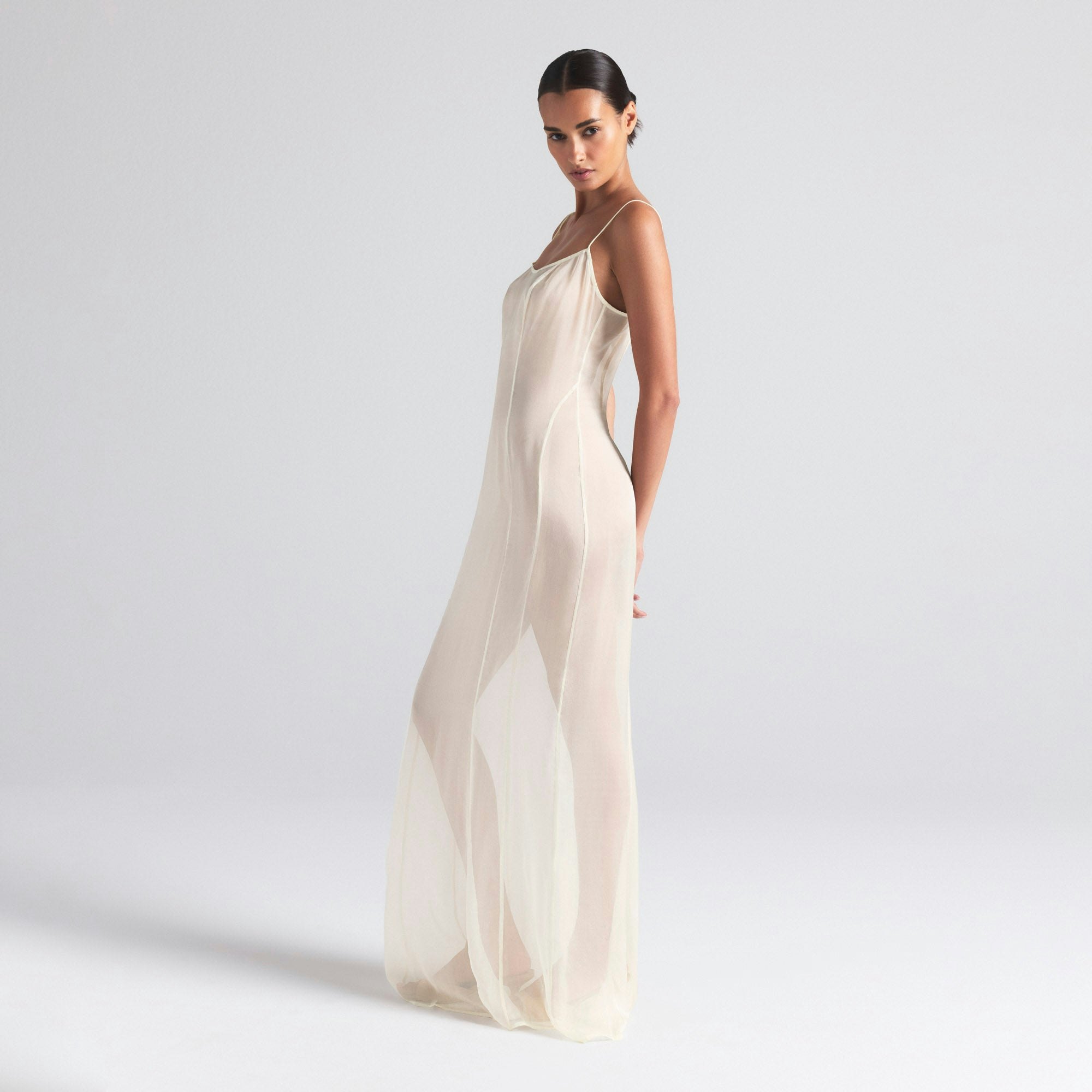 SKIMS ROMANCE LONG SLIP DRESS | IVORY ON A MODEL SIDE  ON A MODEL FRONT VIEW | FOCUS: 0.0, 1.0, 0.9