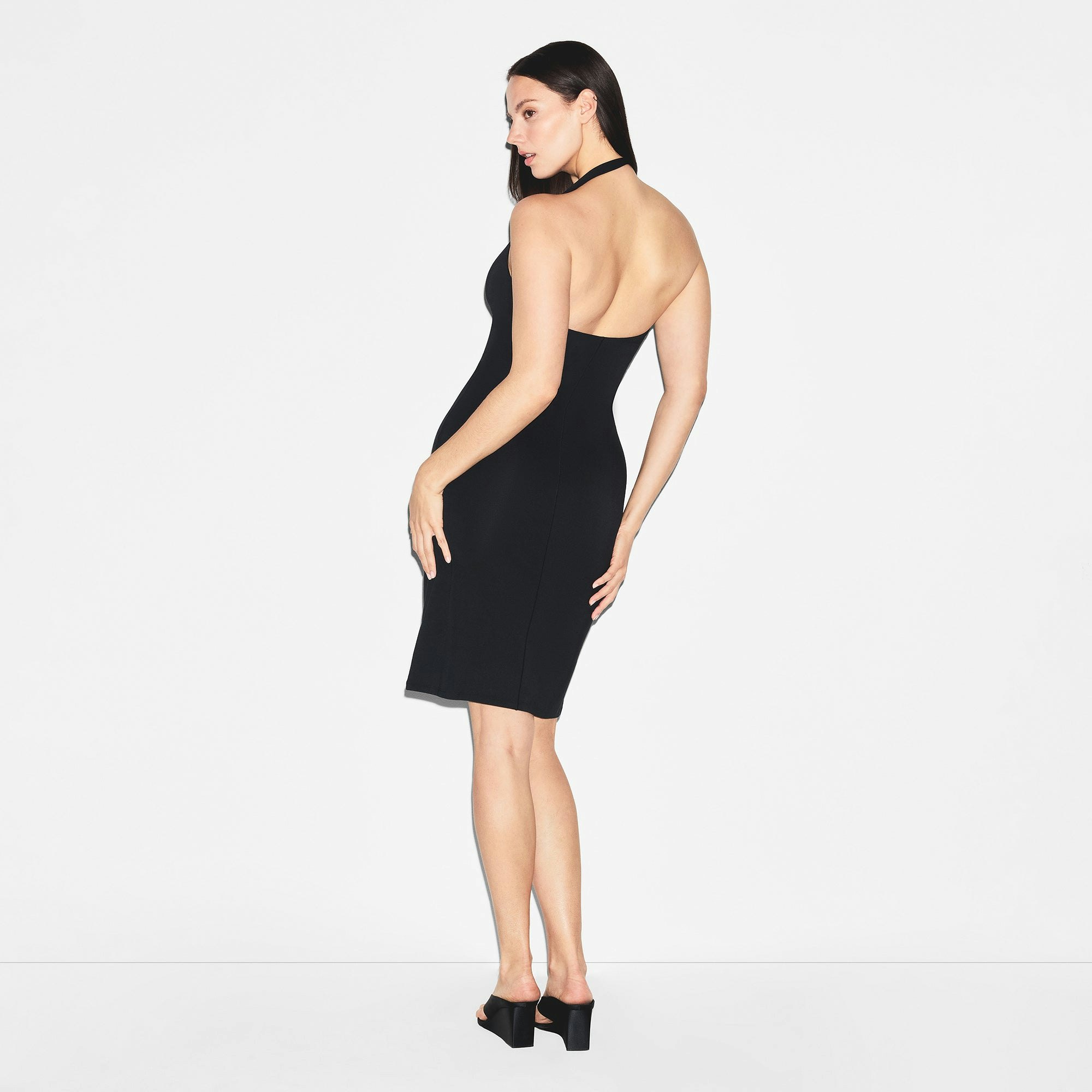 SMOOTH LAYERS HALTER MIDI DRESS | OBSIDIAN ON A MODEL BACK VIEW | FOCUS: 0.0, 1.0, 0.9