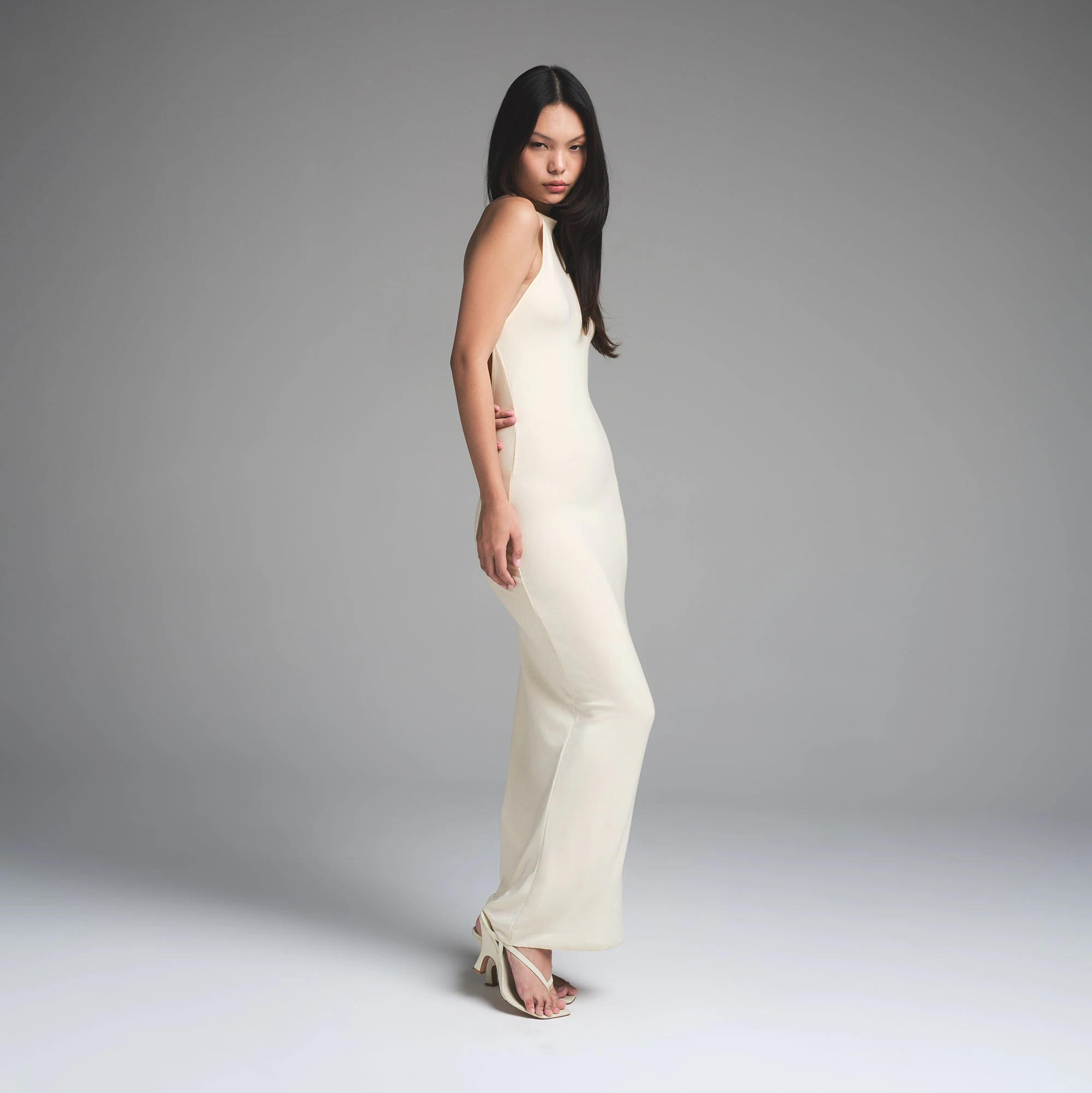 SKIMS CLOUD HALTER LONG DRESS | ECRU ON A MODEL SIDE VIEW | FOCUS: 0.0, 1.0, 0.9