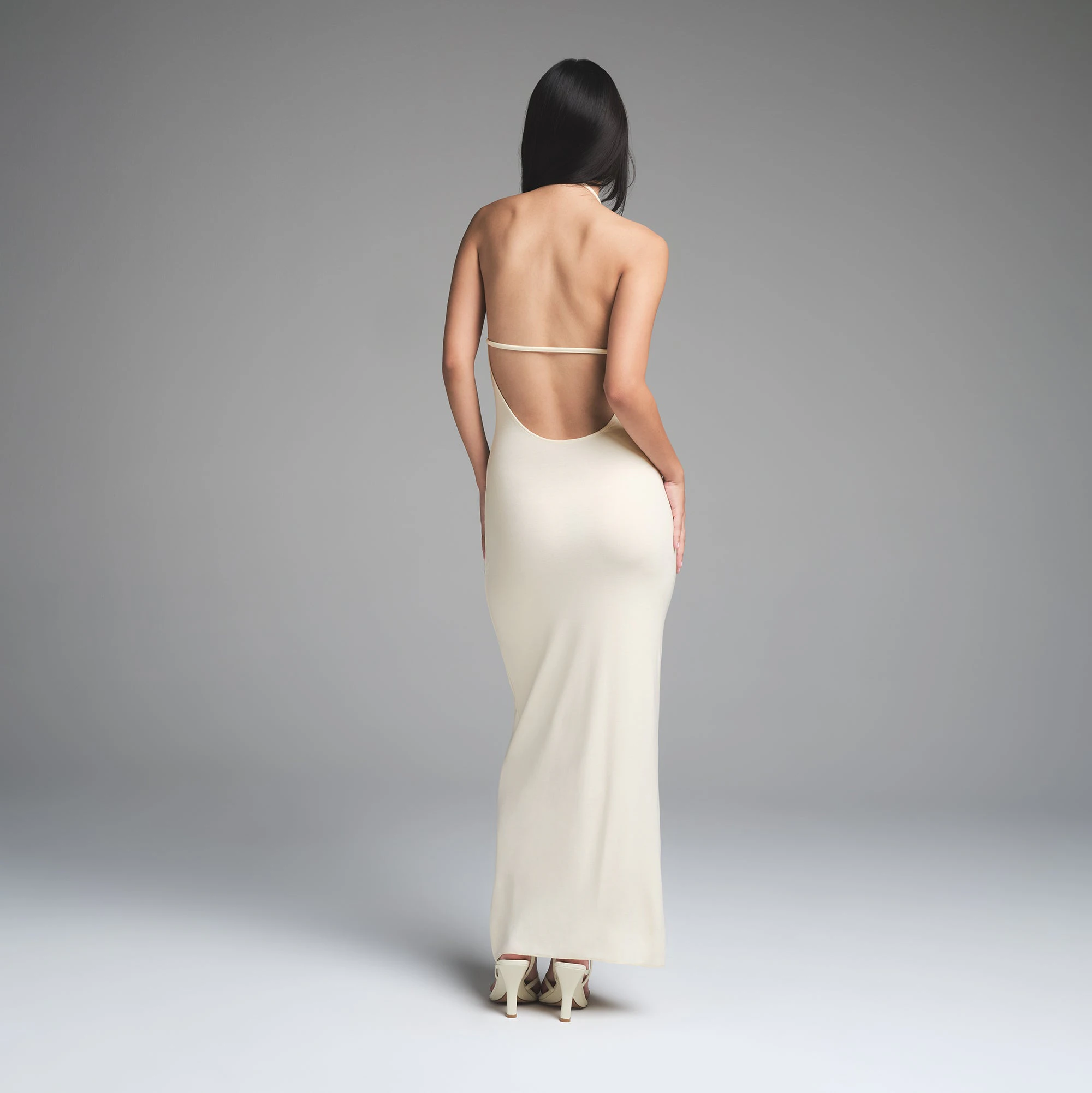 SKIMS CLOUD HALTER LONG DRESS | ECRU ON A MODEL BACK VIEW | FOCUS: 0.0, 1.0, 0.9