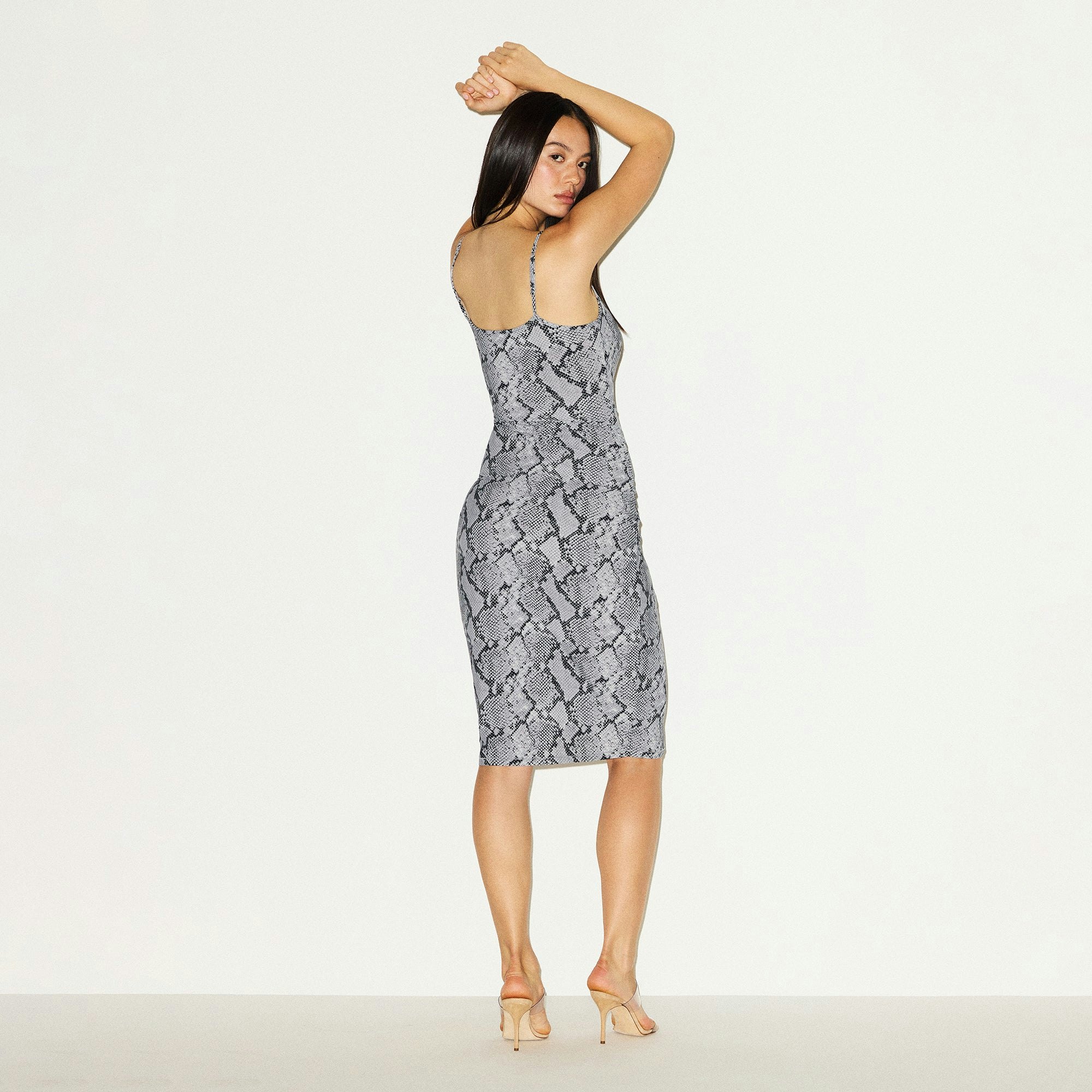 CLING MATTE MIDI DRESS | CHROME SNAKESKIN PRINT ON A MODEL BACK VIEW @ | FOCUS: 0.0, 1.0, 0.9