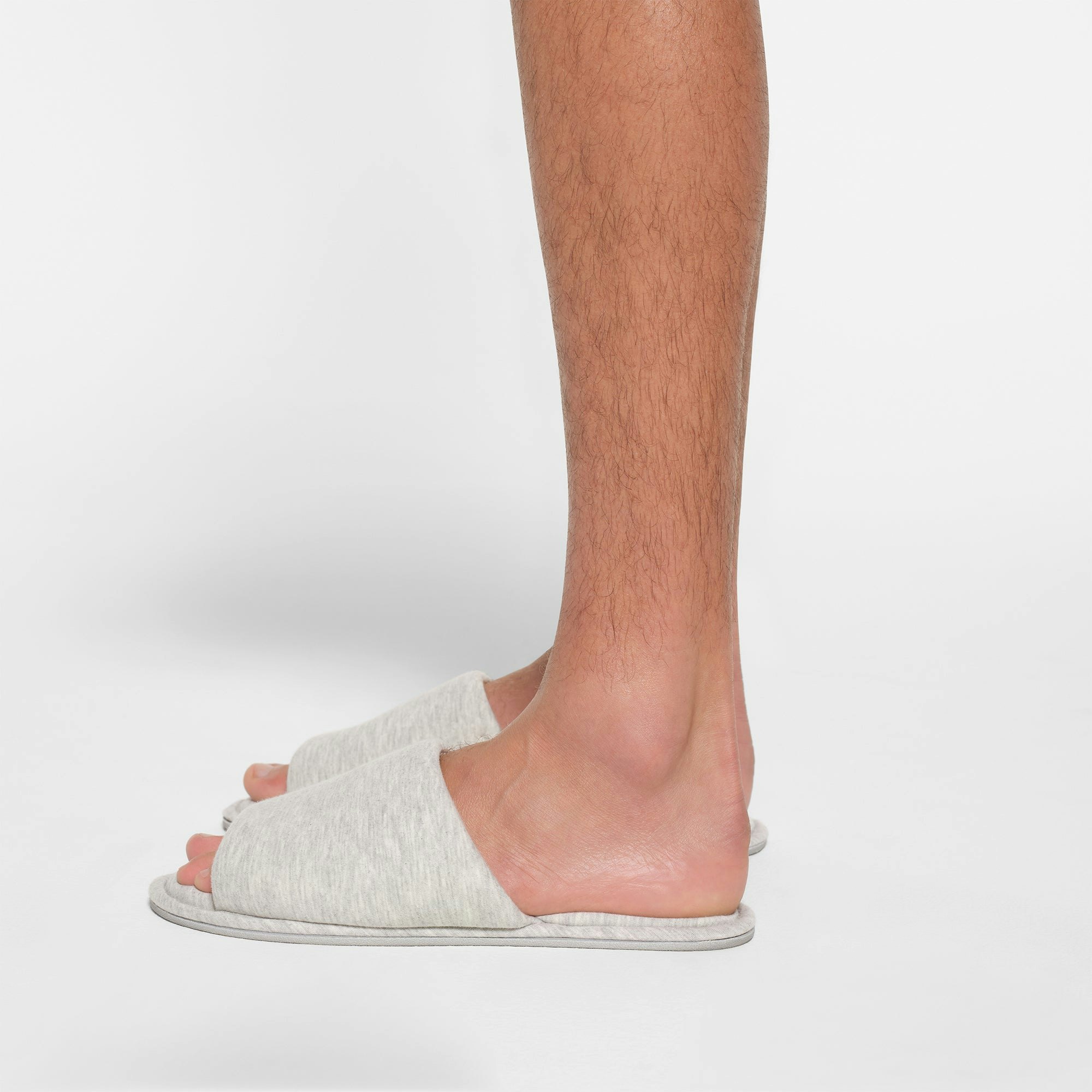COTTON SLIPPER | LIGHT HEATHER GREY ON A MODEL SIDE VIEW
