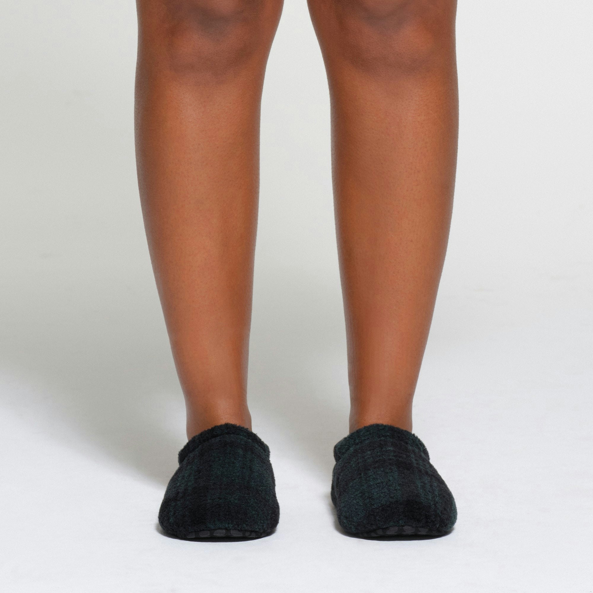 FLEECE SLEEP UNISEX SLIPPER | CYPRESS PLAID ON A MODEL FRONT VIEW