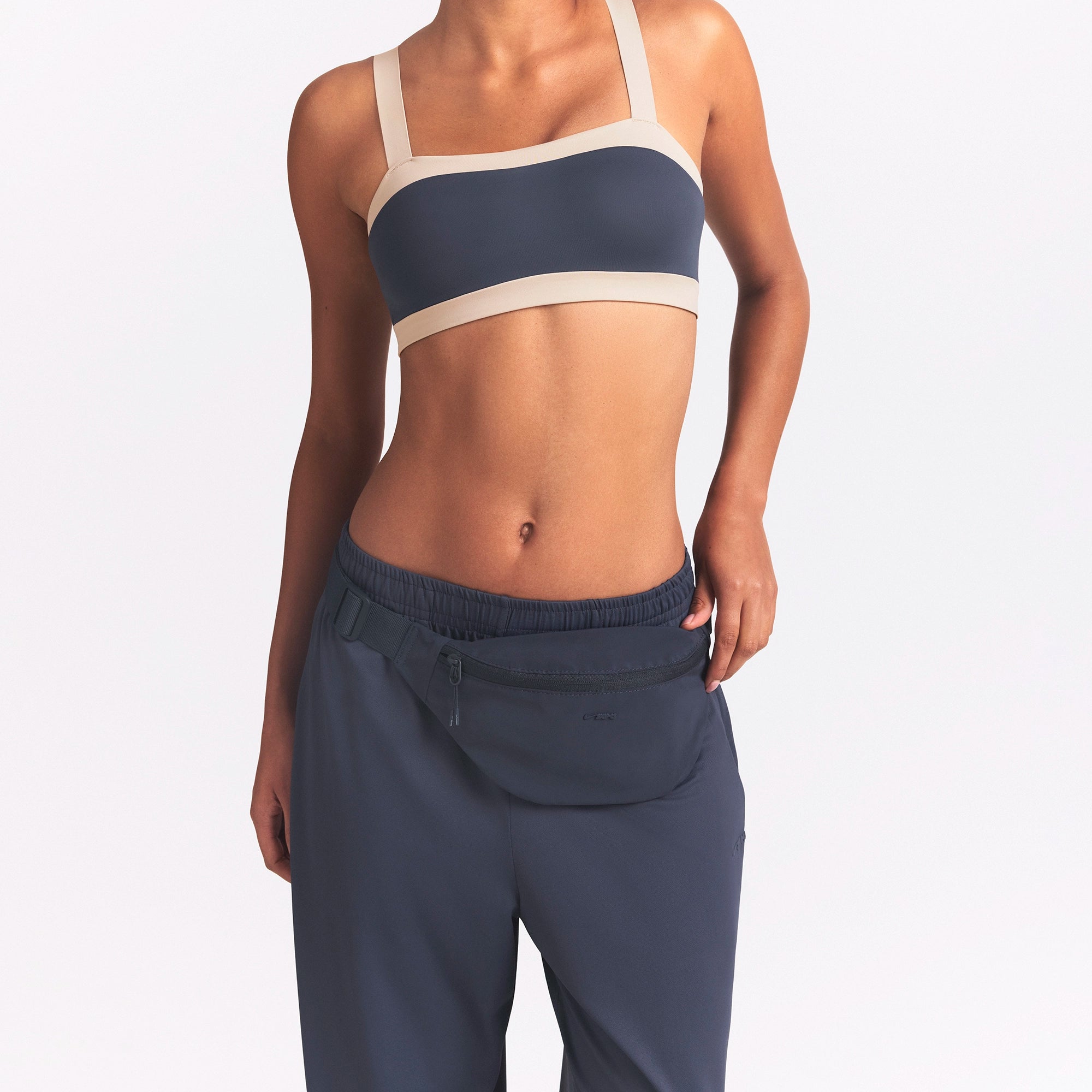 NikeSKIMS ACCESSORIES FANNY PACK | DEEP ROYAL ON A MODEL FRONT VIEW @ | FOCUS: 0.0, 1.0, 0.9