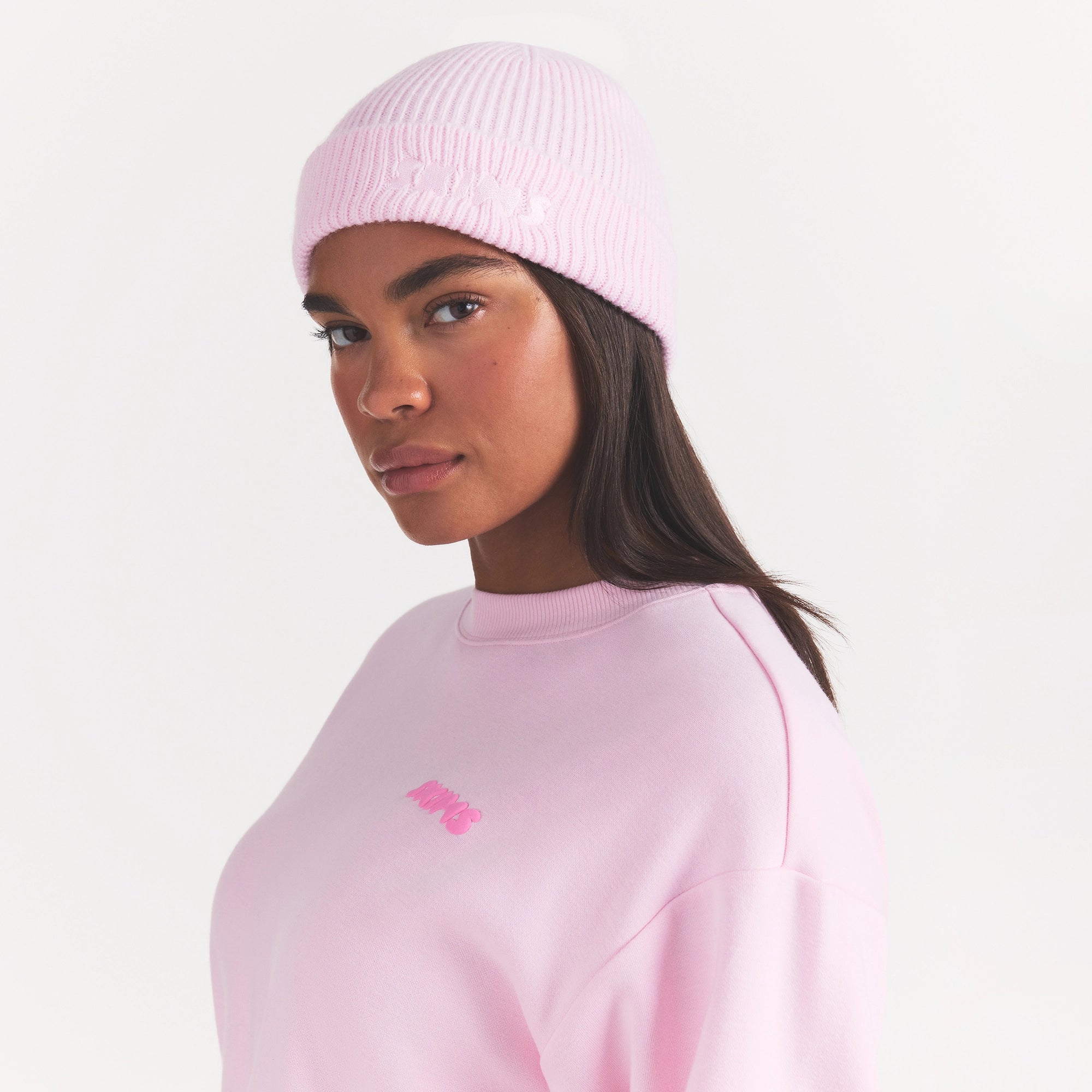 WOOL BLEND KNIT BEANIE | CHERRY BLOSSOM ON A MODEL SIDE VIEW @ | FOCUS: 0.0, 1.0, 0.9