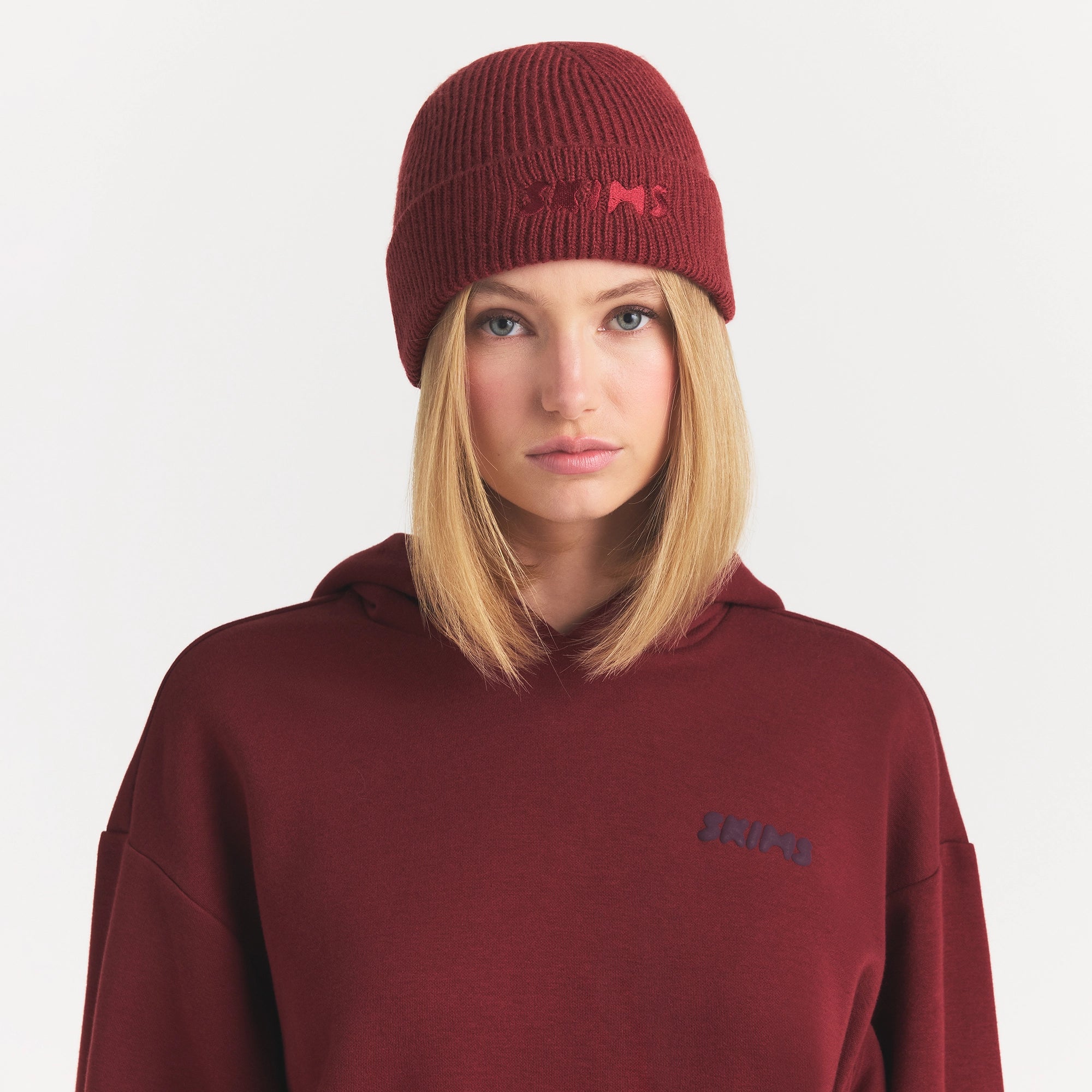 WOOL BLEND KNIT BEANIE | MERLOT ON A MODEL FRONT VIEW @ | FOCUS: 0.0, 1.0, 0.9
