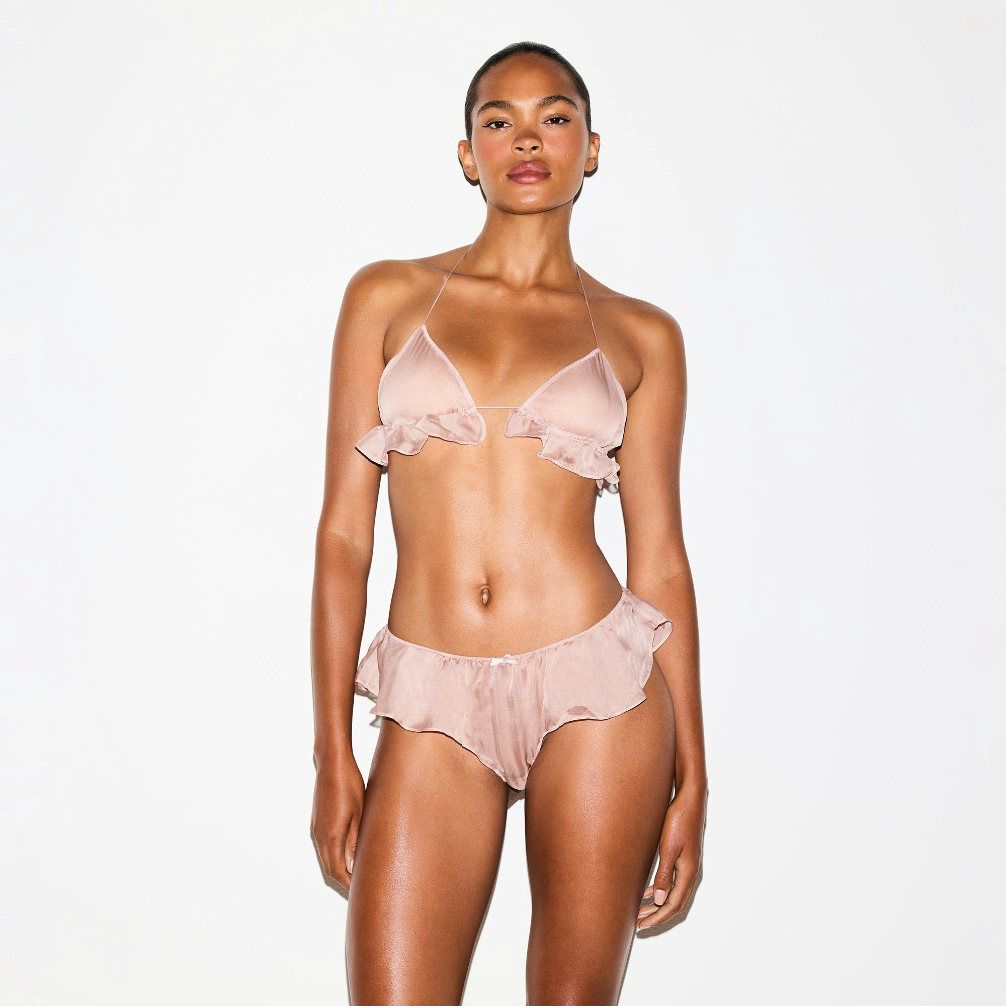 SKIMS ROMANCE LOW RISE HIPSTER | LIGHT FAWN ON A MODEL FRONT VIEW