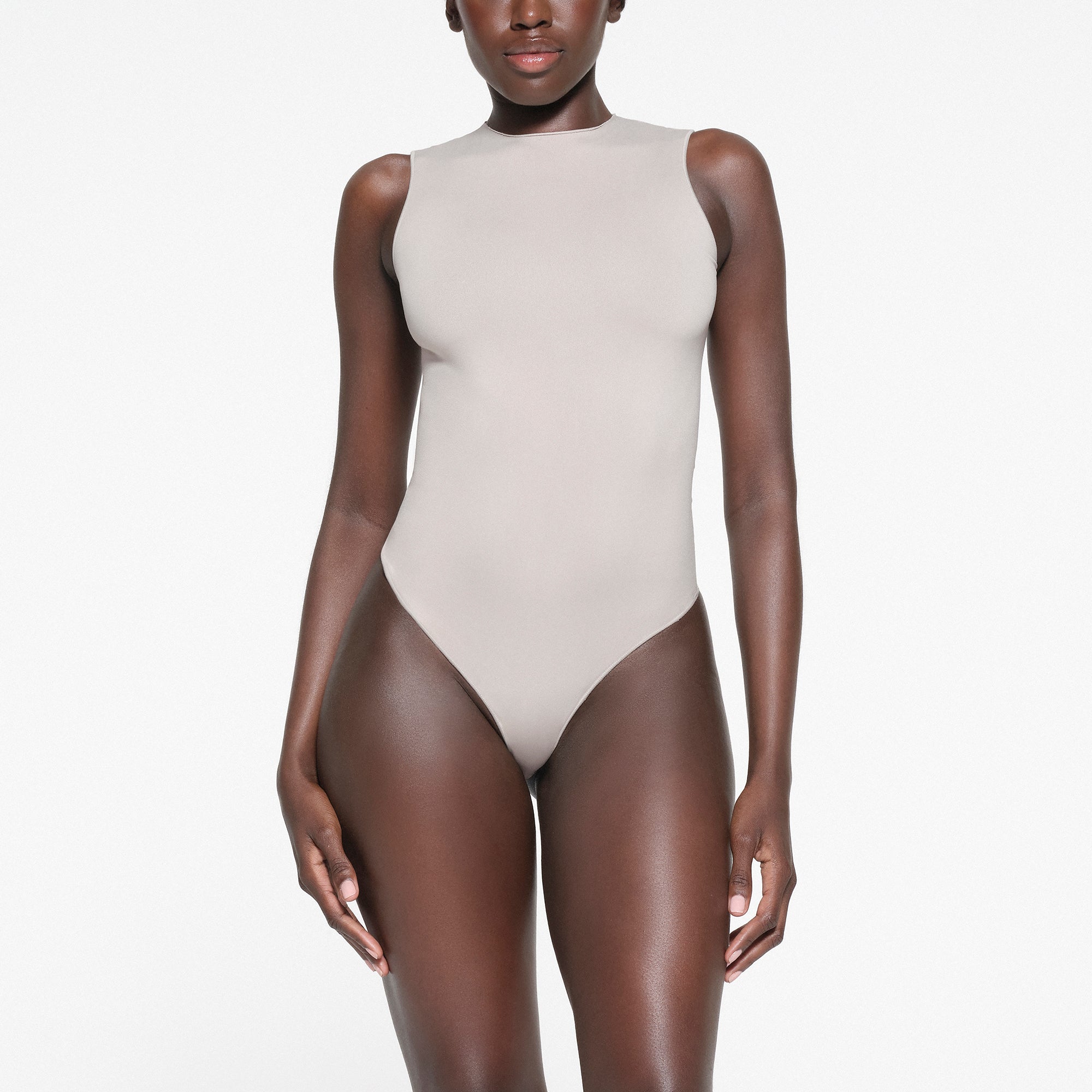 ESSENTIAL CREW NECK SLEEVELESS BODYSUIT STONE