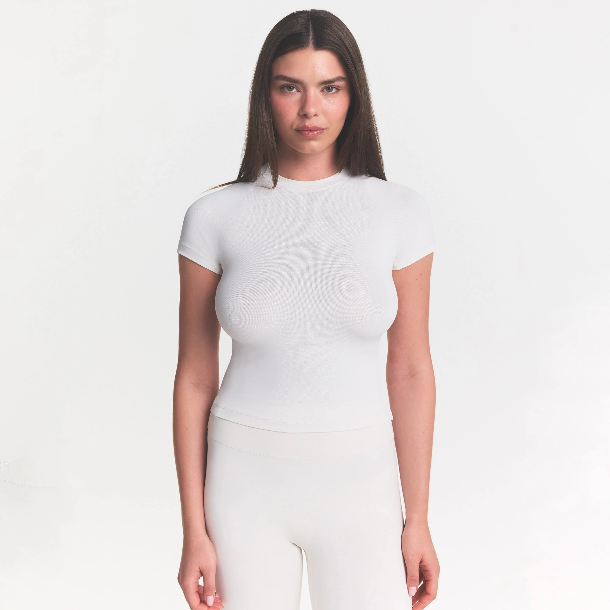 NikeSKIMS MATTE PADDED BABY TEE | IVORY ON A MODEL