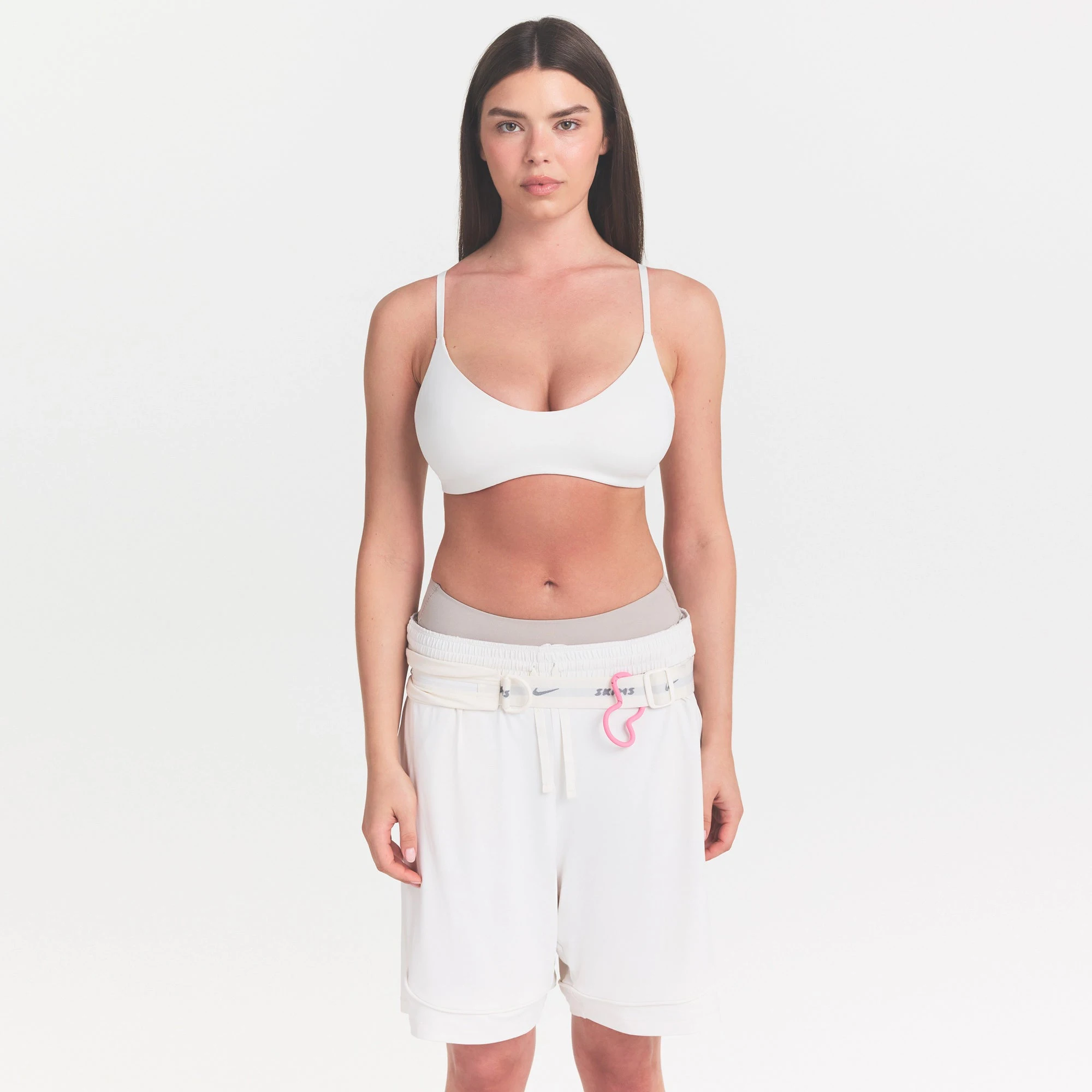 NikeSKIMS MATTE MICRO SCOOP BRA | IVORY ON A MODEL