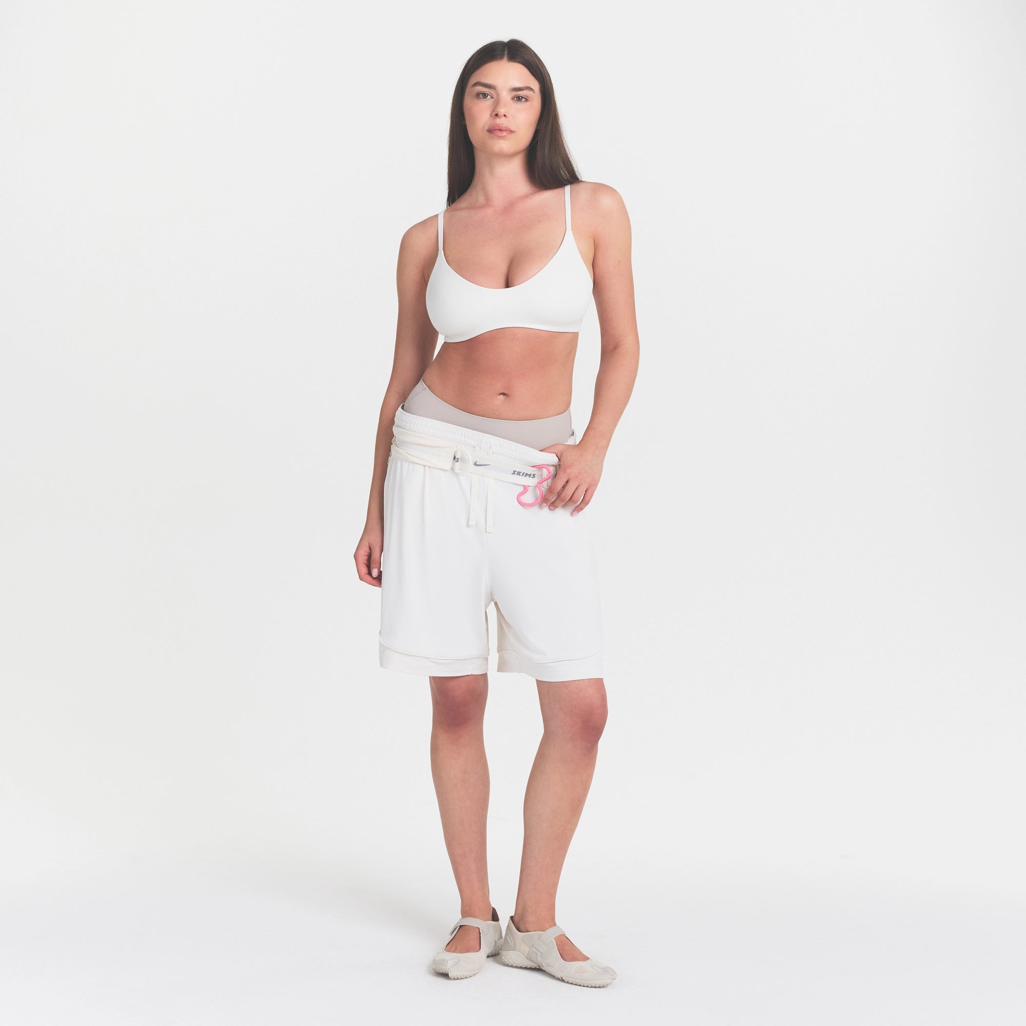 NikeSKIMS MATTE MICRO SCOOP BRA | IVORY ON A MODEL 
