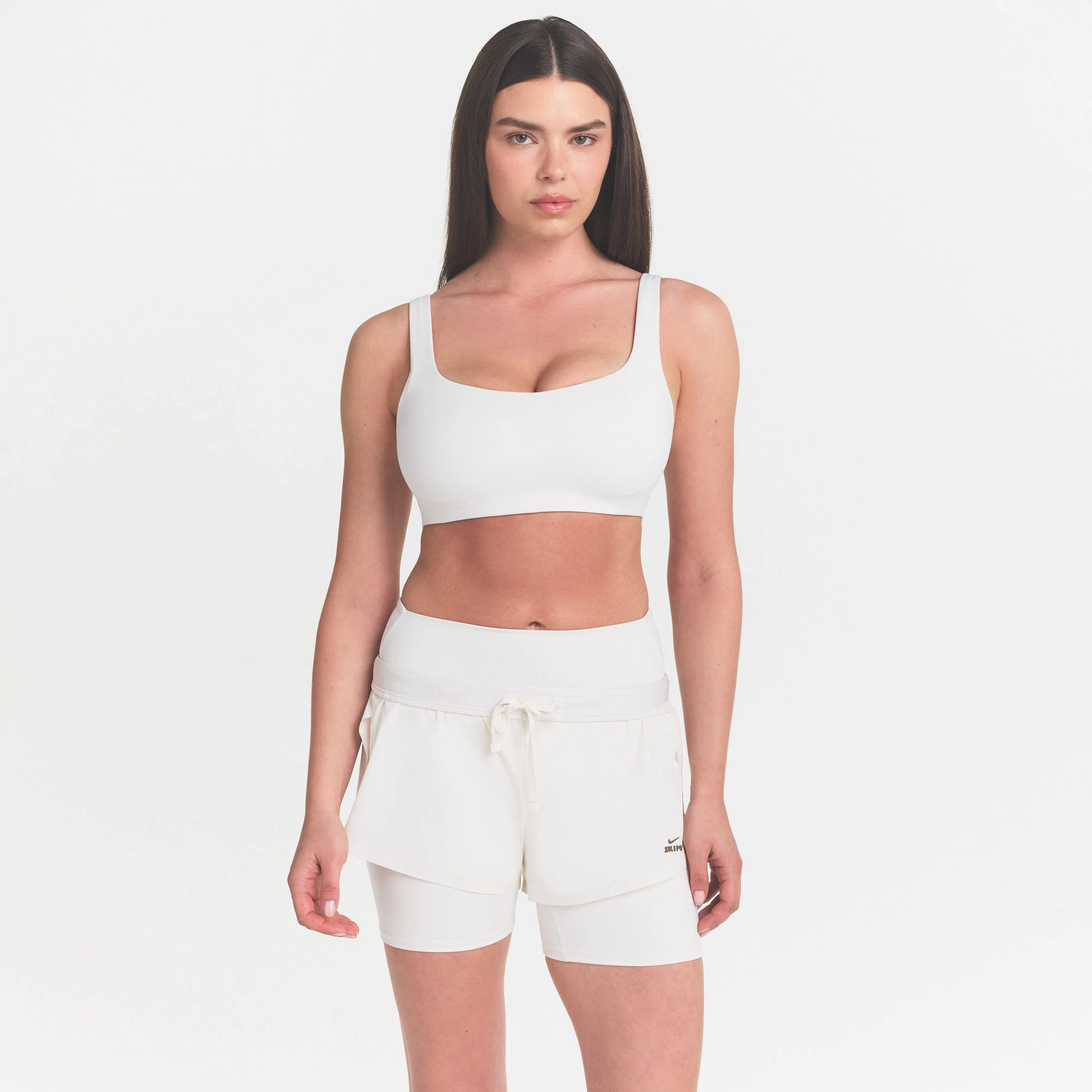 NikeSKIMS MATTE SCOOP NECK BRA | IVORY ON A MODEL VIEW @ | FOCUS: 0.0, 1.0, 0.9