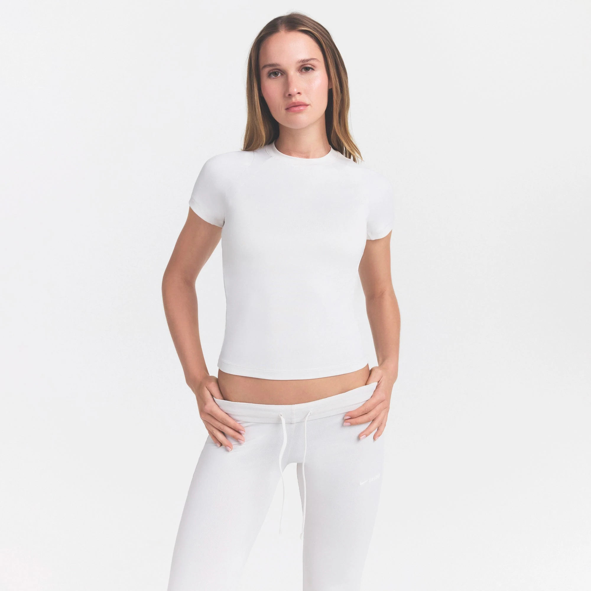 NikeSKIMS AIRY BABY TEE | IVORY ON A MODEL VIEW @ | FOCUS: 0.0, 1.0, 0.9